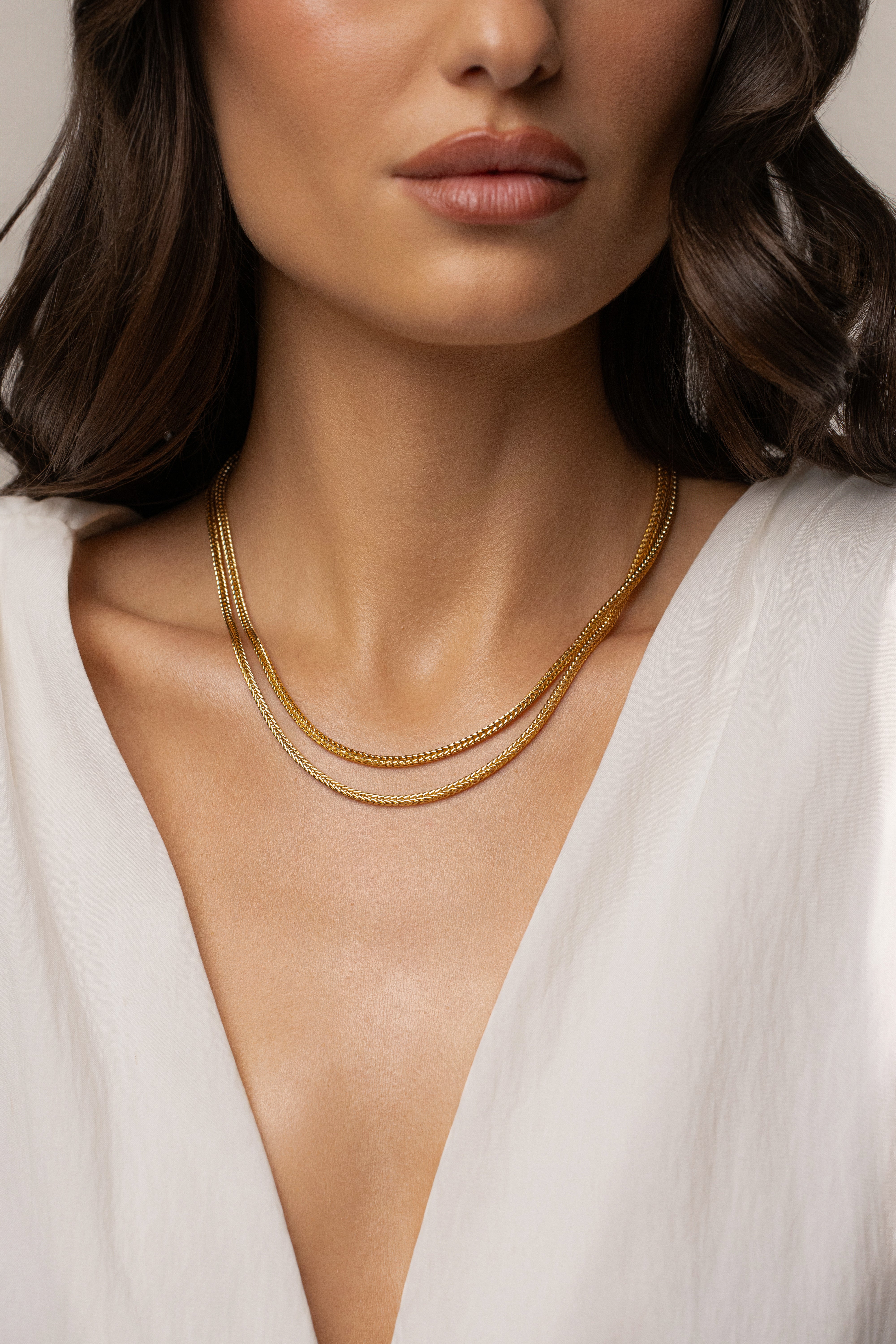 Gold double herringbone necklace from JLUXLABEL, showcasing sleek layered jewelry with a polished finish.