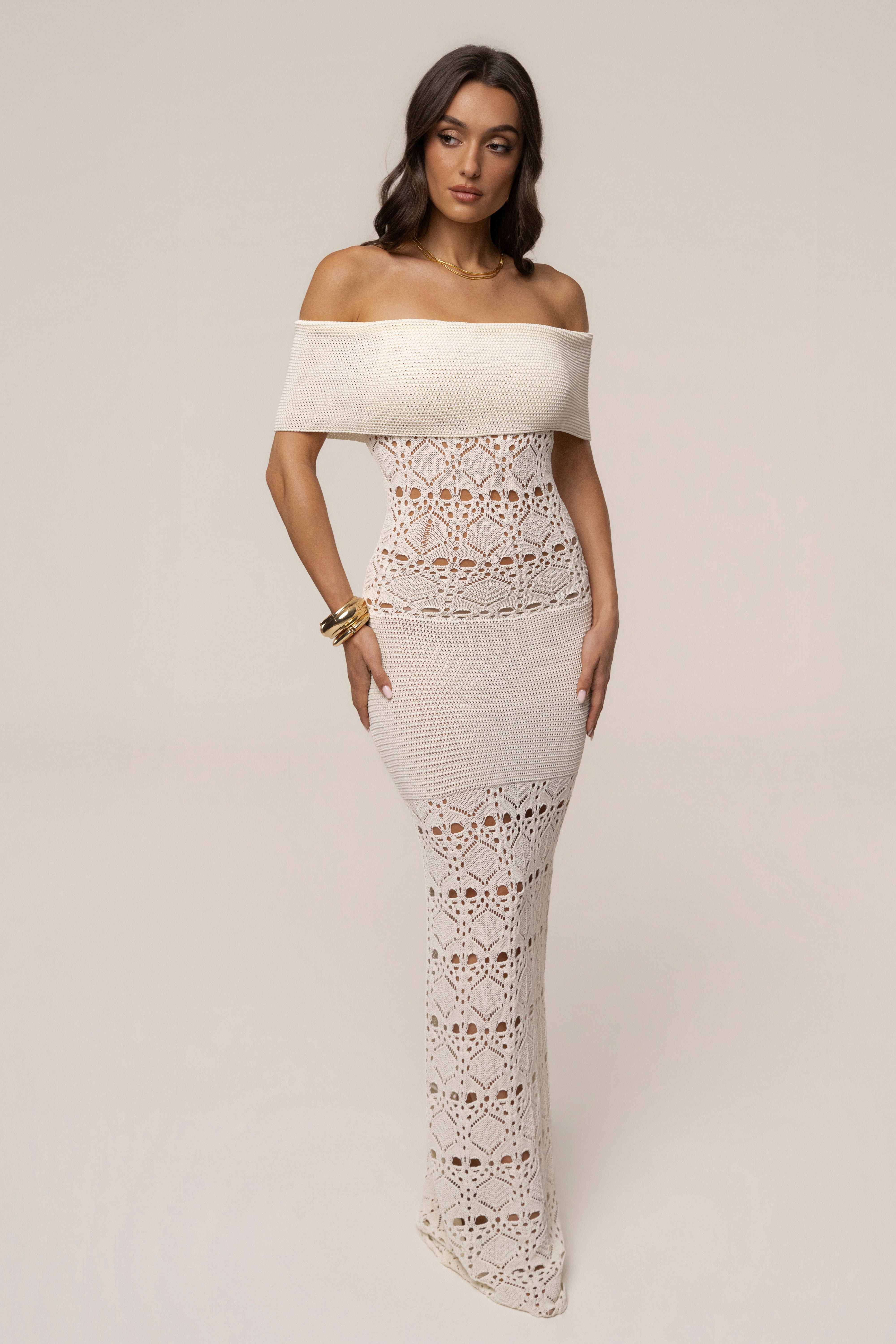 Ivory JLUXLABEL Resort Nights maxi dress displayed on a hanger, featuring a flowing fabric and elegant design for summer wear.