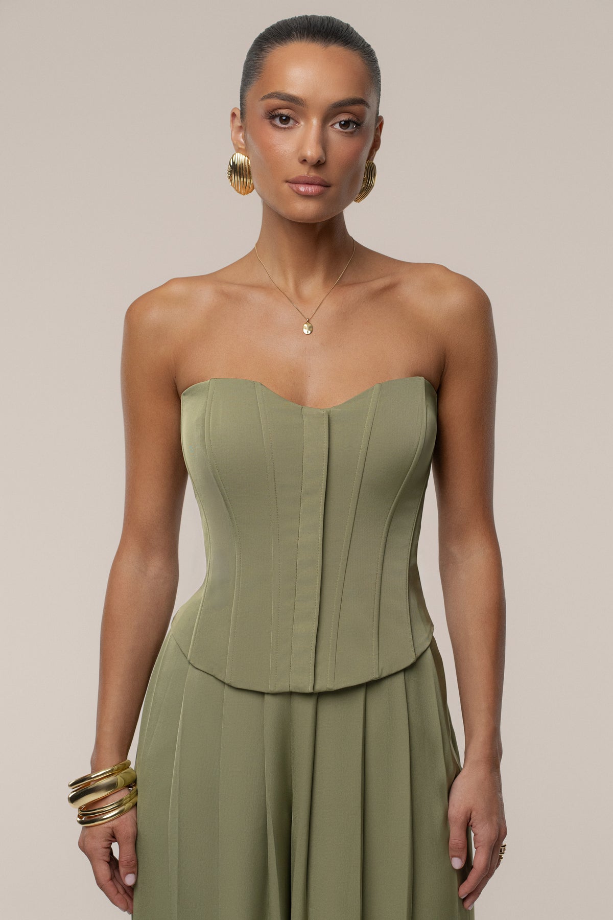 Olive satin bustier top by JLUXLABEL featuring a fitted design and structured bustier style, perfect for stylish outfits.