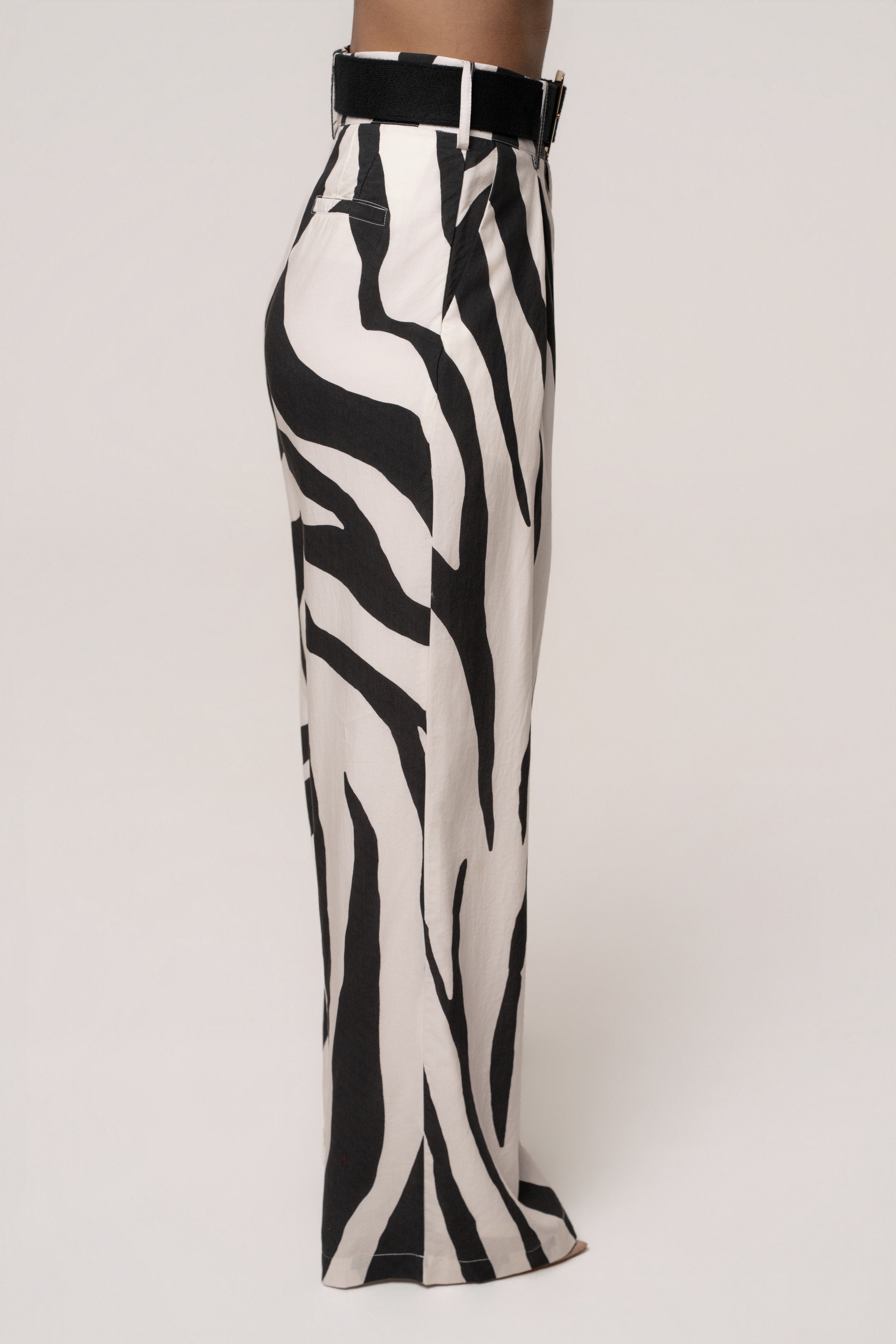 JLUXLABEL Zebra Prime Trouser showing black and white striped bottoms with tailored fit and waistband detail.