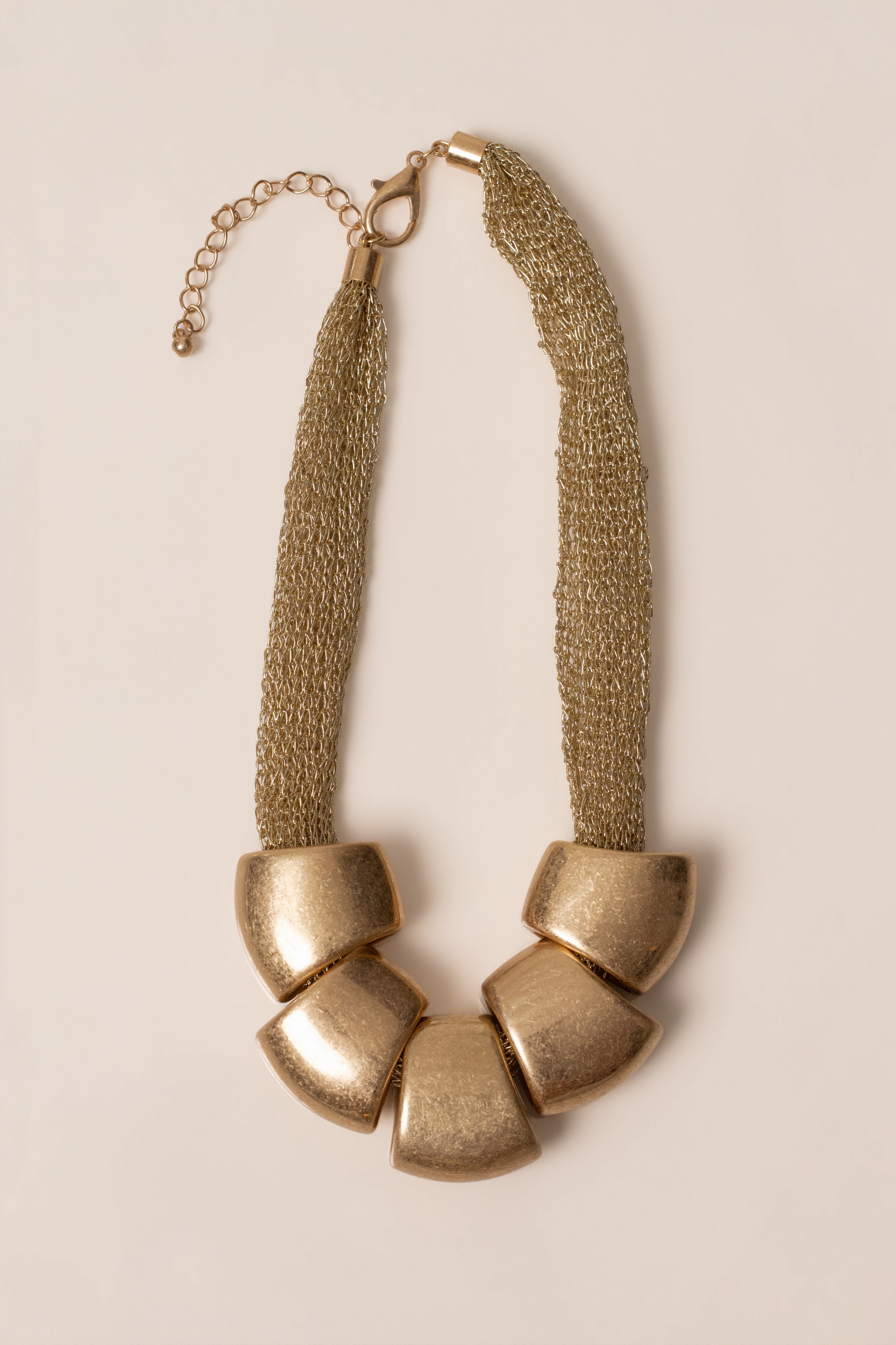 Gold Mila Pebble Necklace by JLUXLABEL featuring smooth pebble-shaped jewelry with a delicate chain.