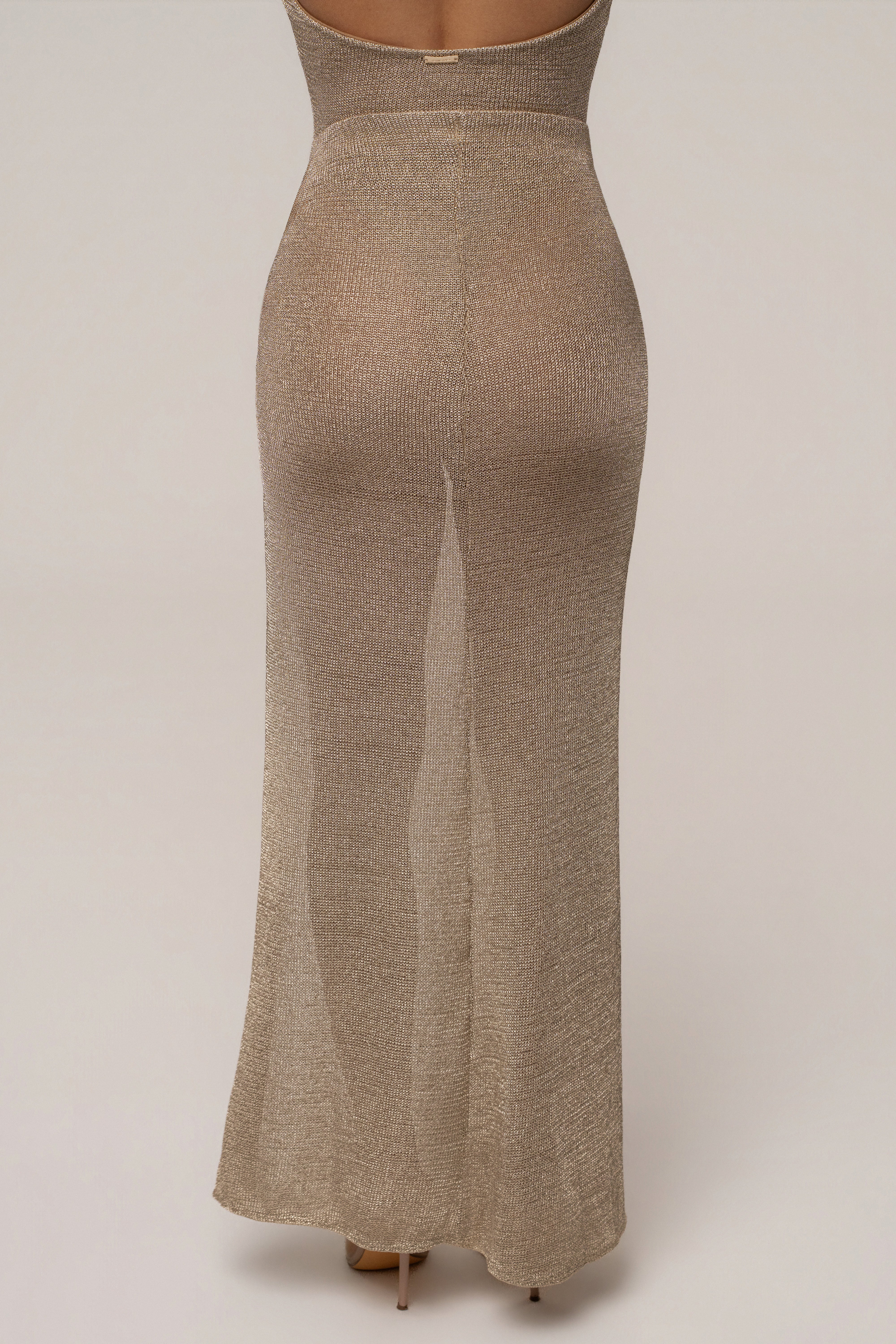 Gold Surreal Knit Skirt Set by JLUXLABEL featuring a stylish knit top and matching skirt on a neutral background.