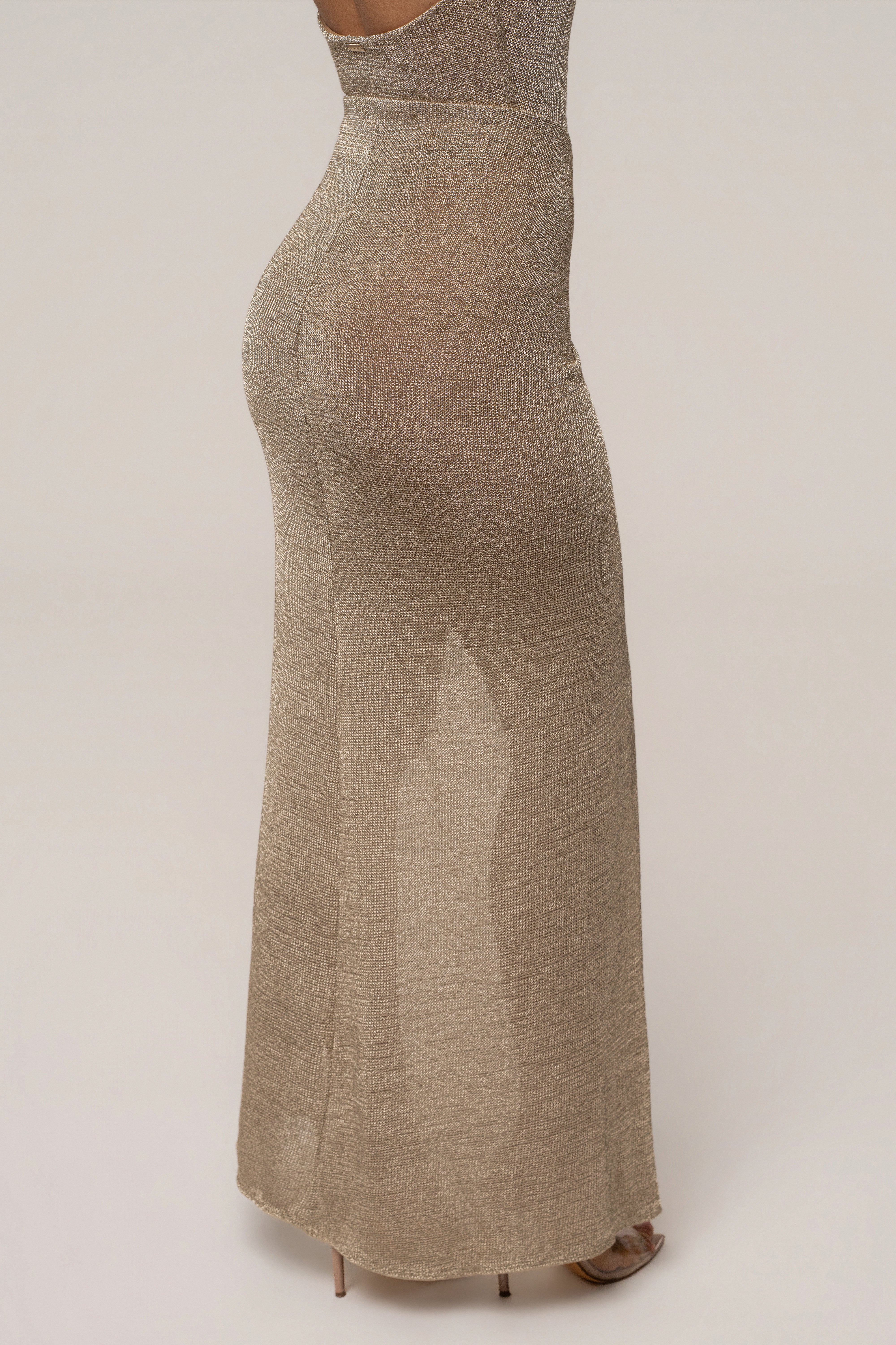Gold Surreal Knit Skirt Set by JLUXLABEL featuring a stylish knit skirt and matching top on a model.