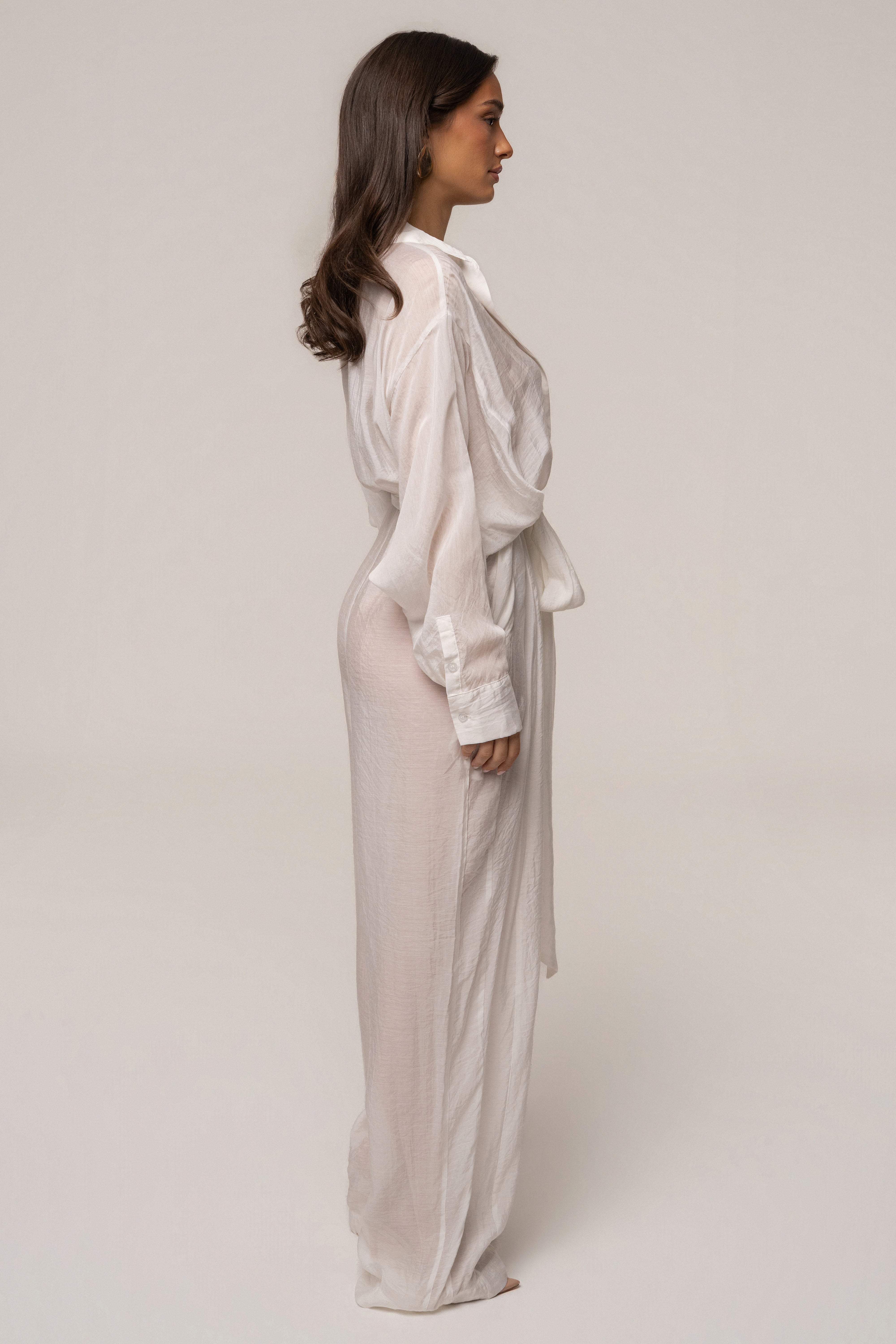 Ivory JLUXLABEL Soho tailored jumpsuit with wide legs and sleeveless design, displayed on a mannequin.