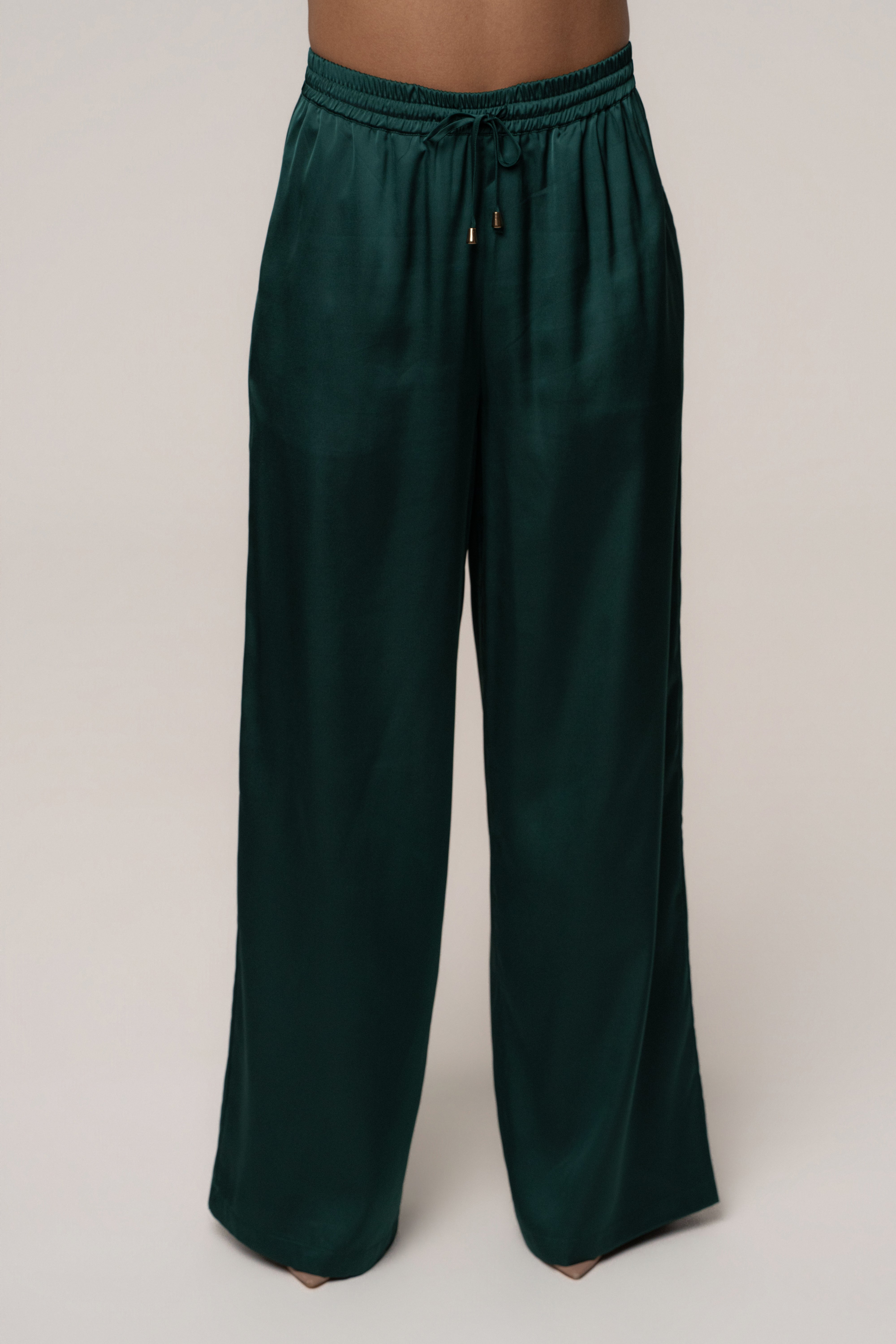 Emerald green JLUXLABEL Sunny Day drawstring pants, stylish bottoms with a relaxed fit and adjustable waistband.