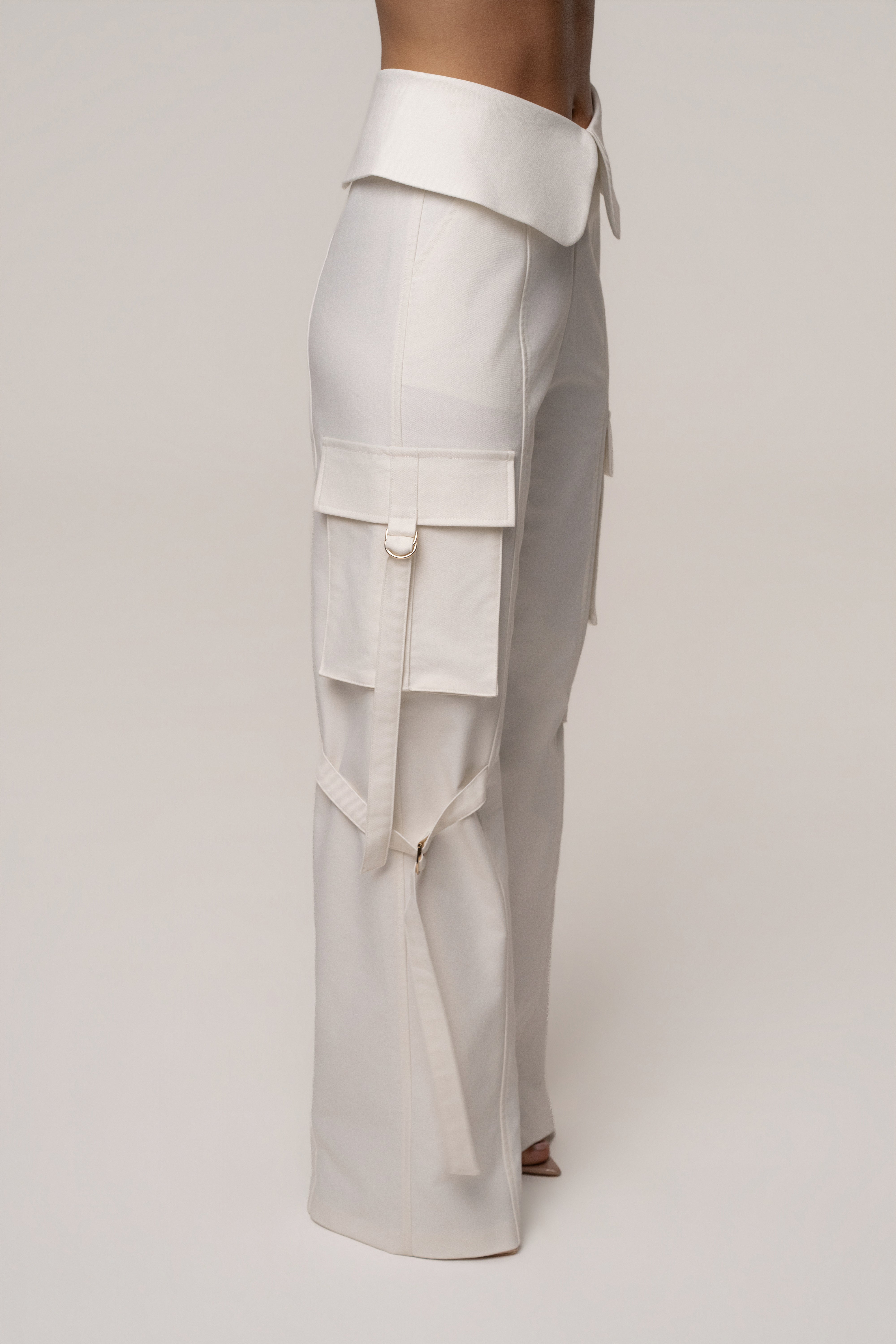 JLUXLABEL Cream Downtown Cargo Pant shown in a relaxed fit with multiple pockets, suitable for casual or streetwear outfits.