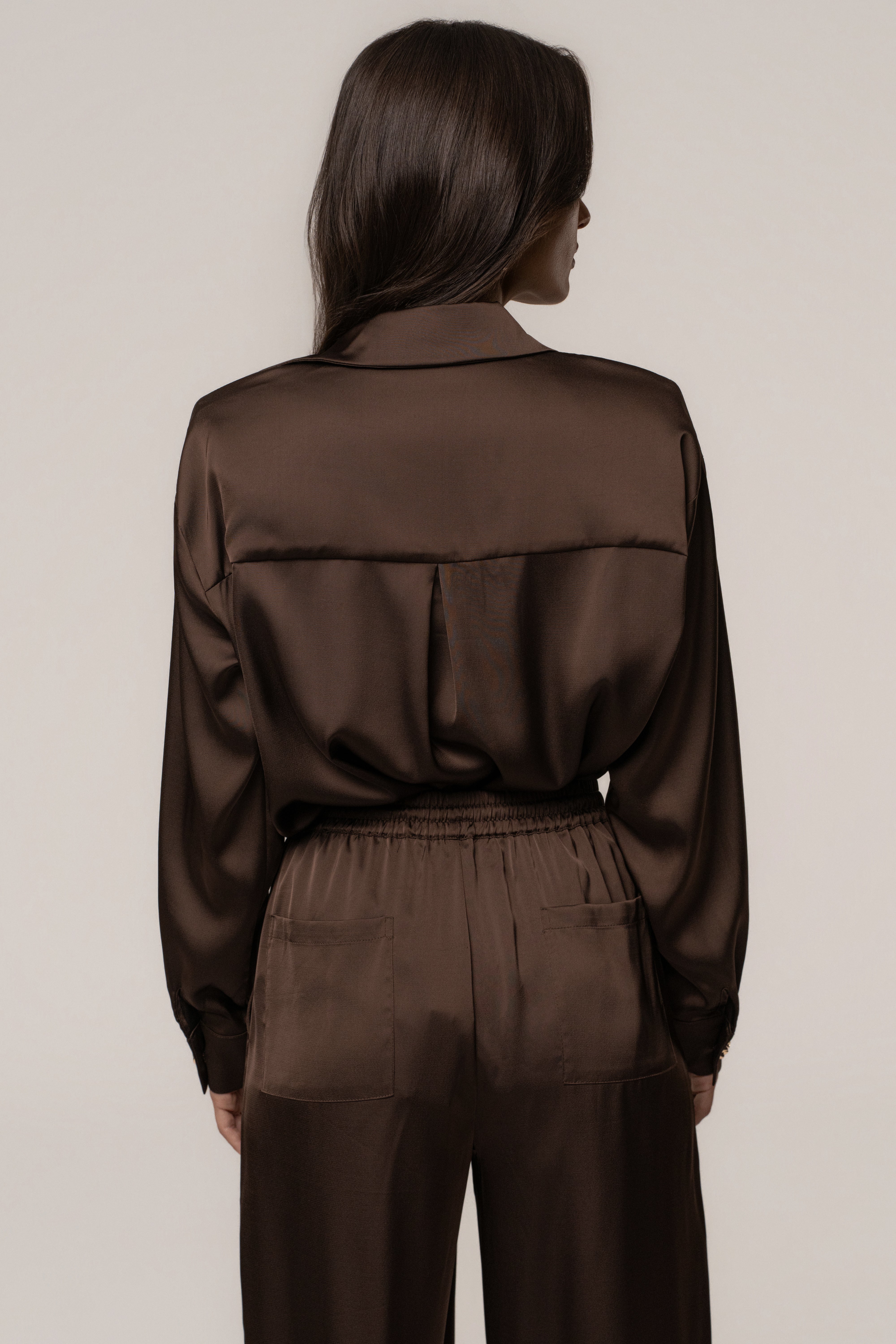 Chocolate Island Ease collared satin top by JLUXLABEL, featuring a sleek design with a collared neckline and smooth satin fabric.