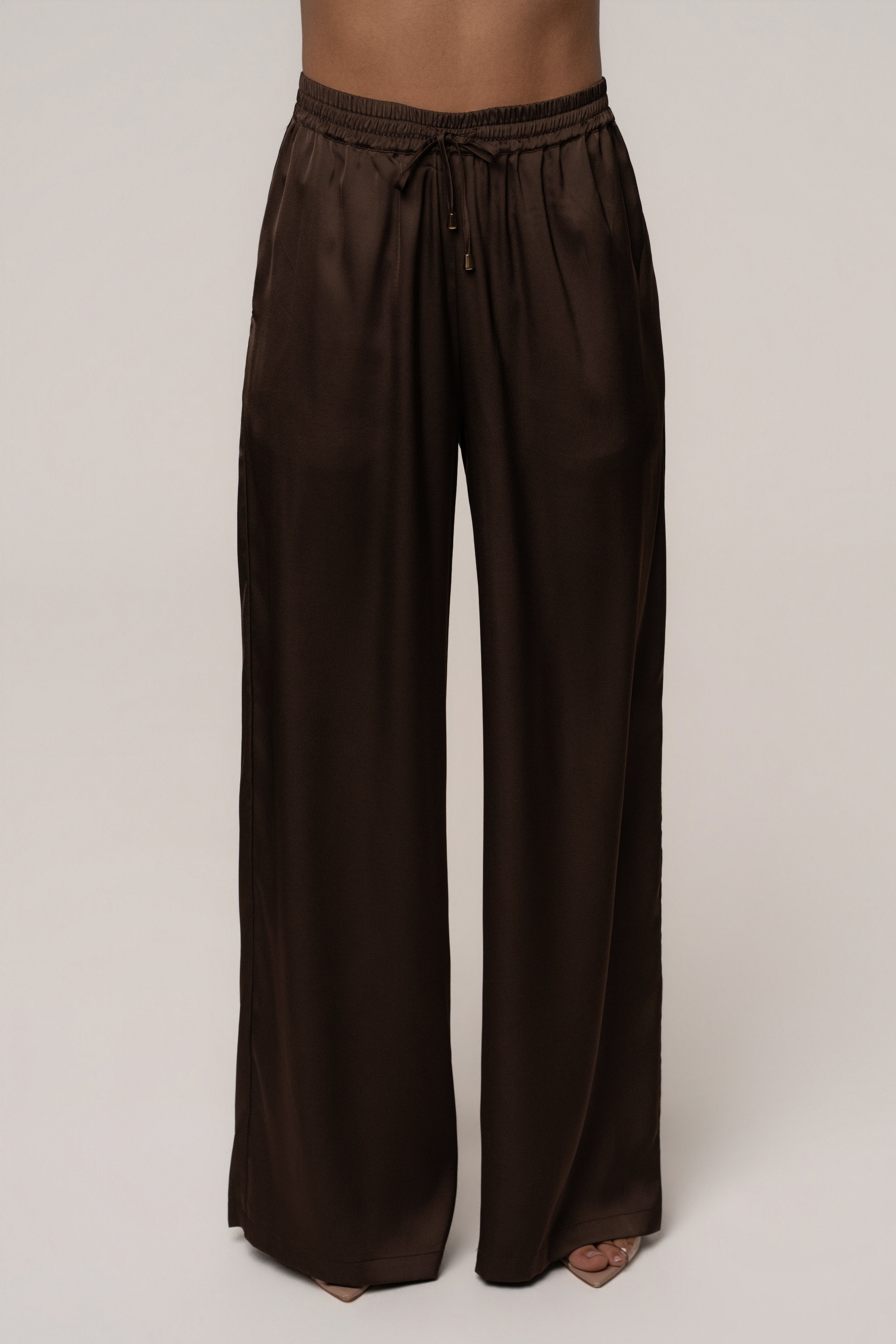 Chocolate Sunny Day Drawstring Pants by JLUXLABEL, featuring relaxed fit bottoms with adjustable drawstring waist and soft fabric.