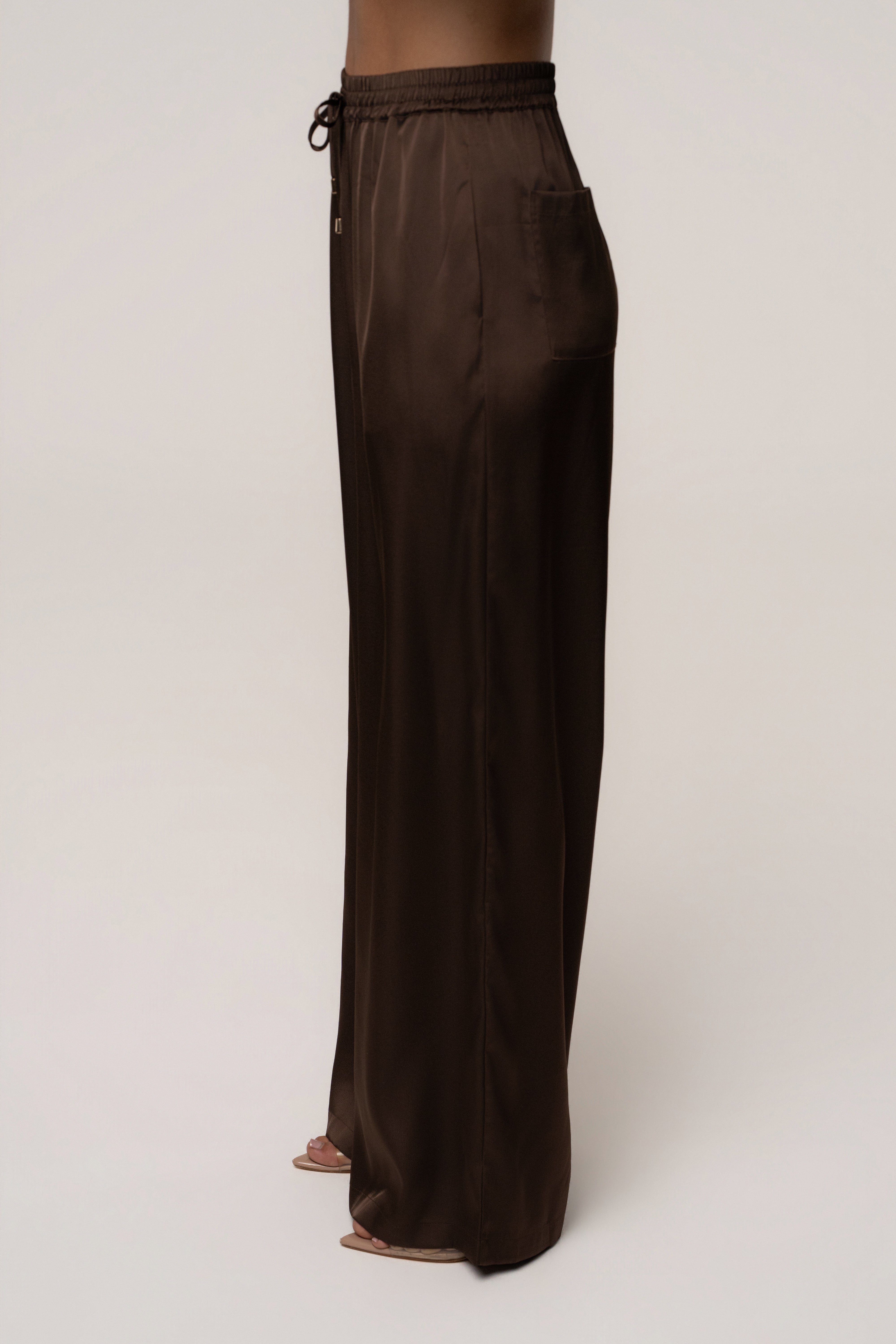 Chocolate Sunny Day Drawstring Pants by JLUXLABEL, featuring relaxed fit bottoms with drawstring waist and soft fabric.