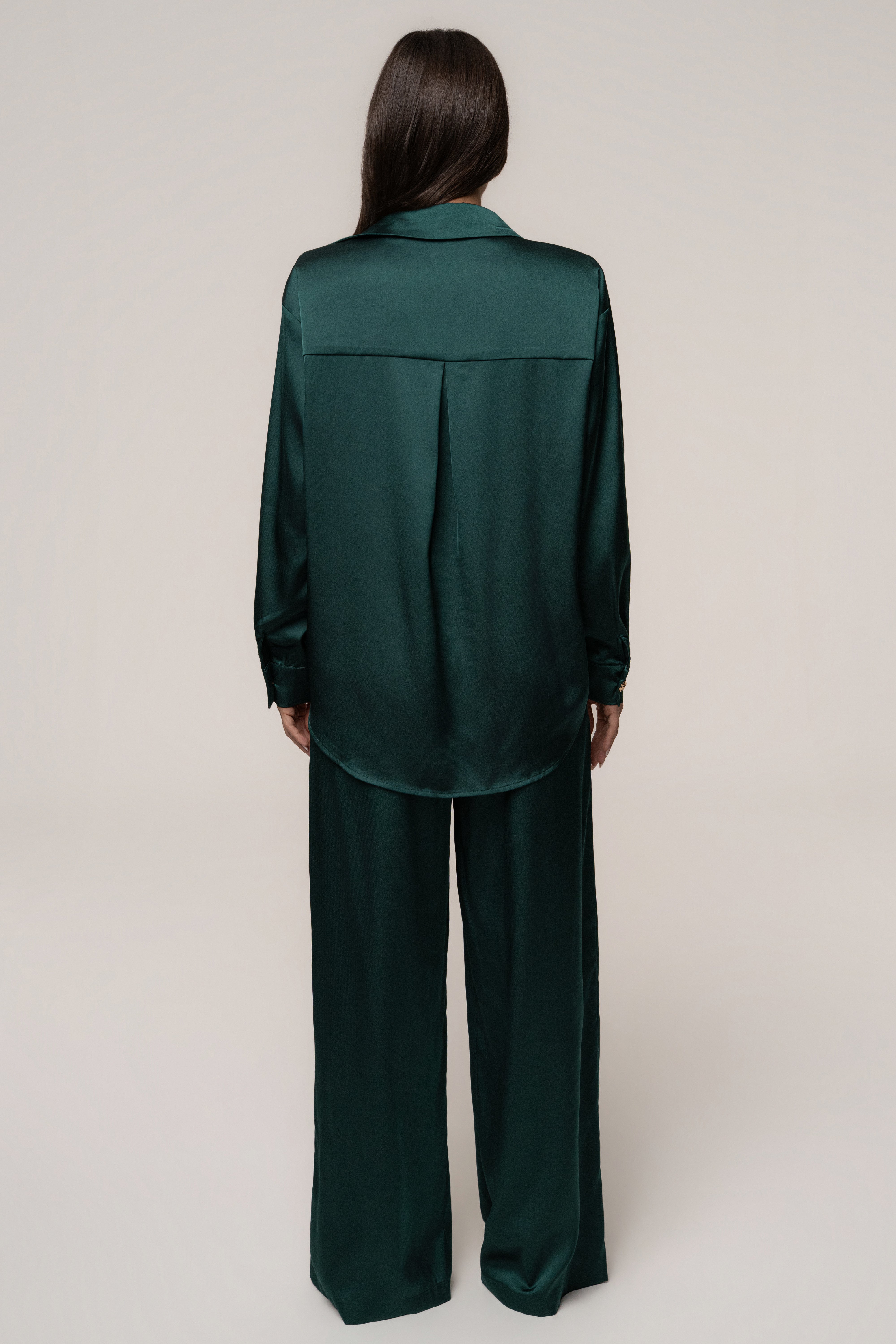 Emerald green satin collared top from JLUXLABEL's Island Ease collection, stylish and smooth fabric, close-up of the collar and fabric.
