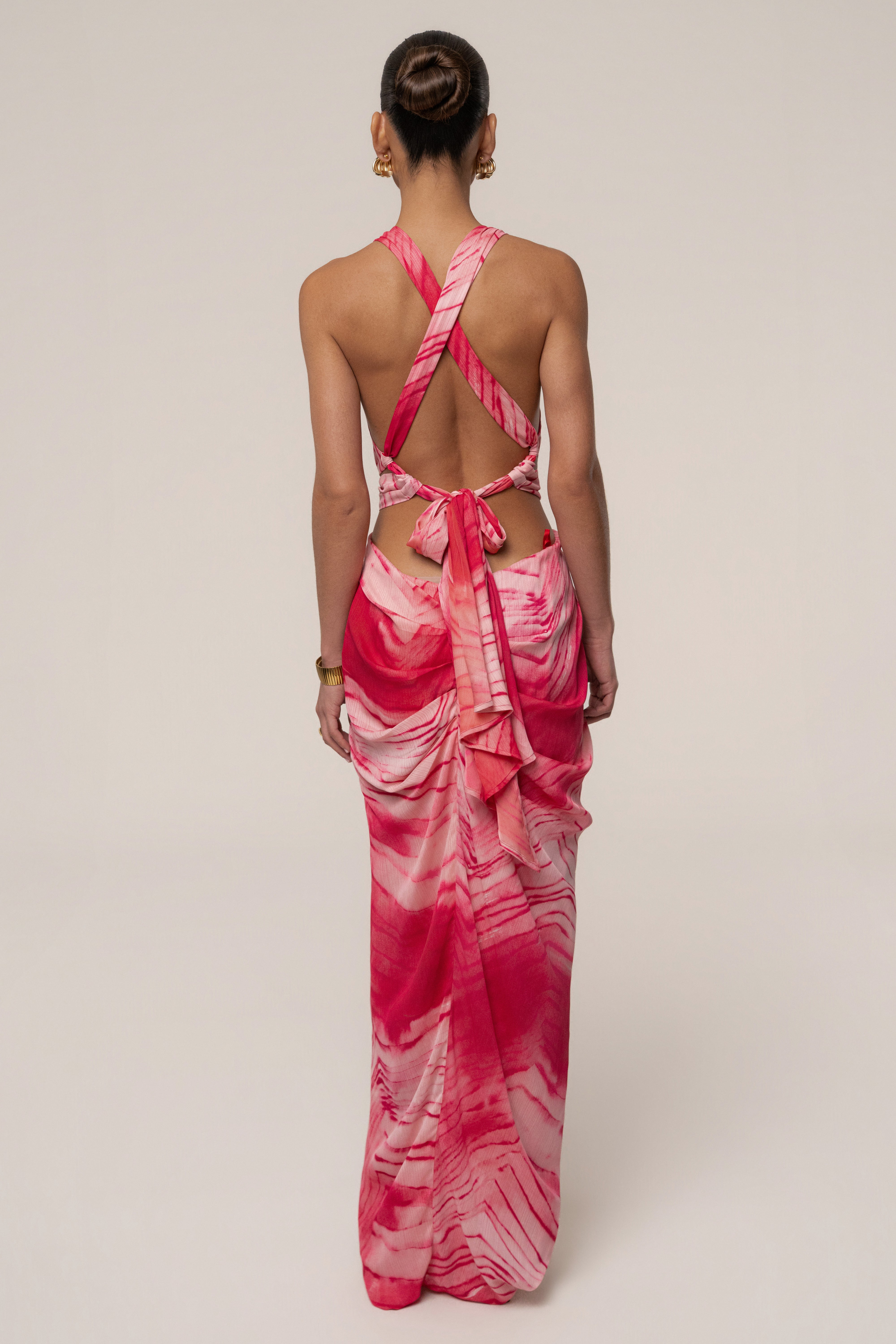 Cherry Coastline Maxi Dress by JLUXLABEL, flowing floral dress with a fitted waist and halter neckline, displayed on a hanger.