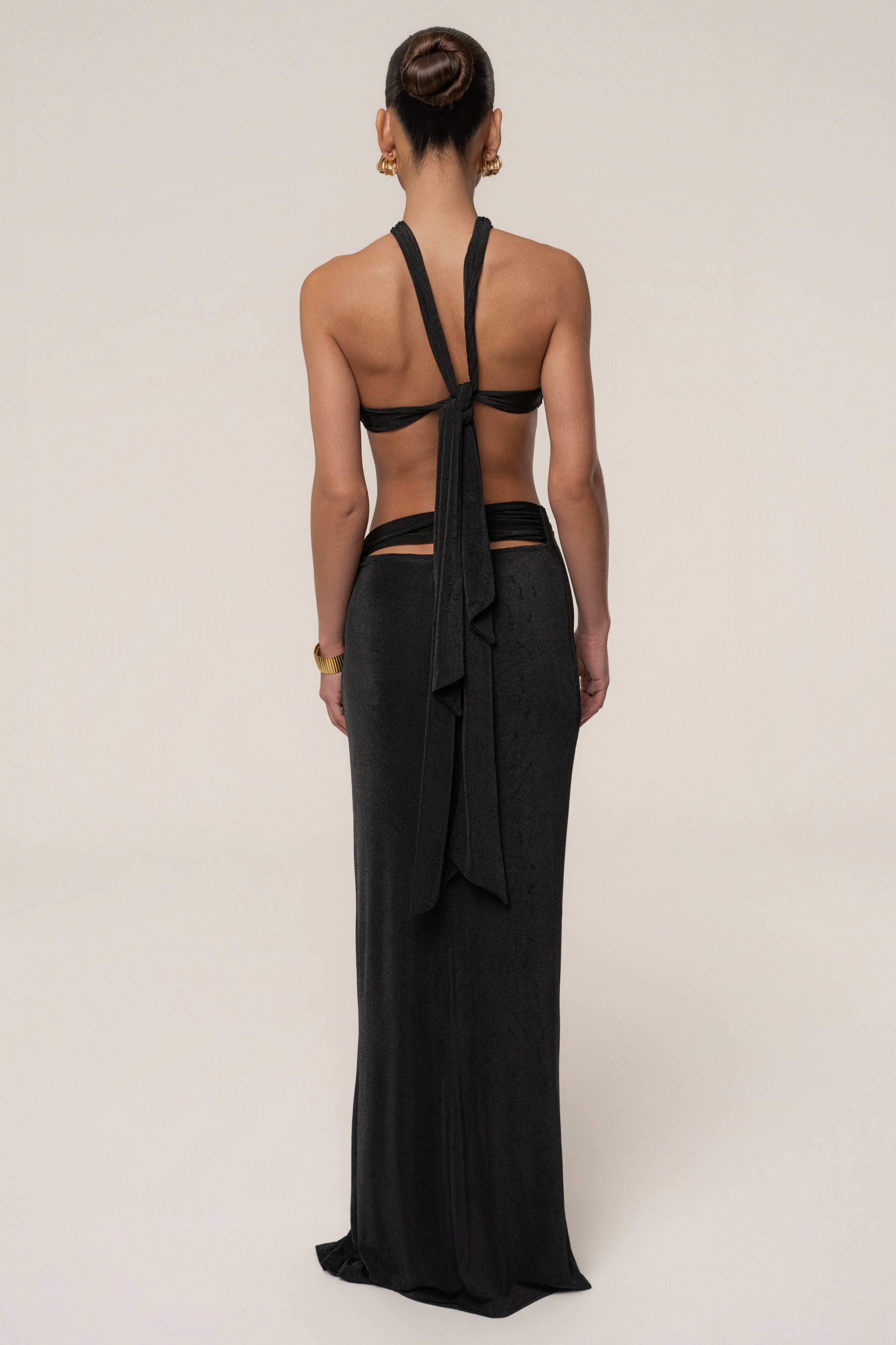 Black City After Dark skirt set by JLUXLABEL showing a stylish two-piece outfit with a fitted skirt and matching top.