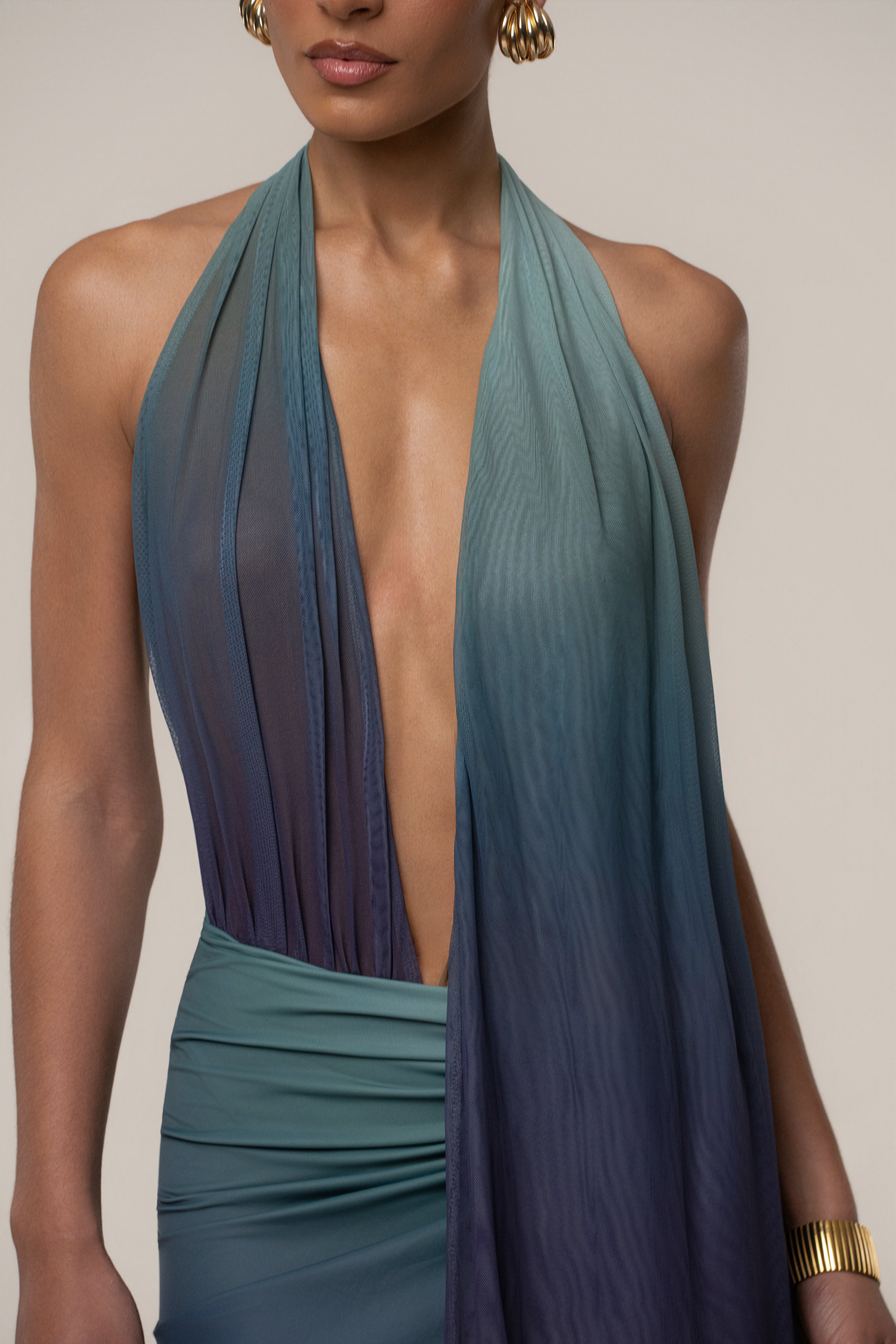 JLUXLABEL Lunar Shadow Bare Form plunge bodysuit, black tops with sleek design and deep V neckline, close-up view of the stylish garment.