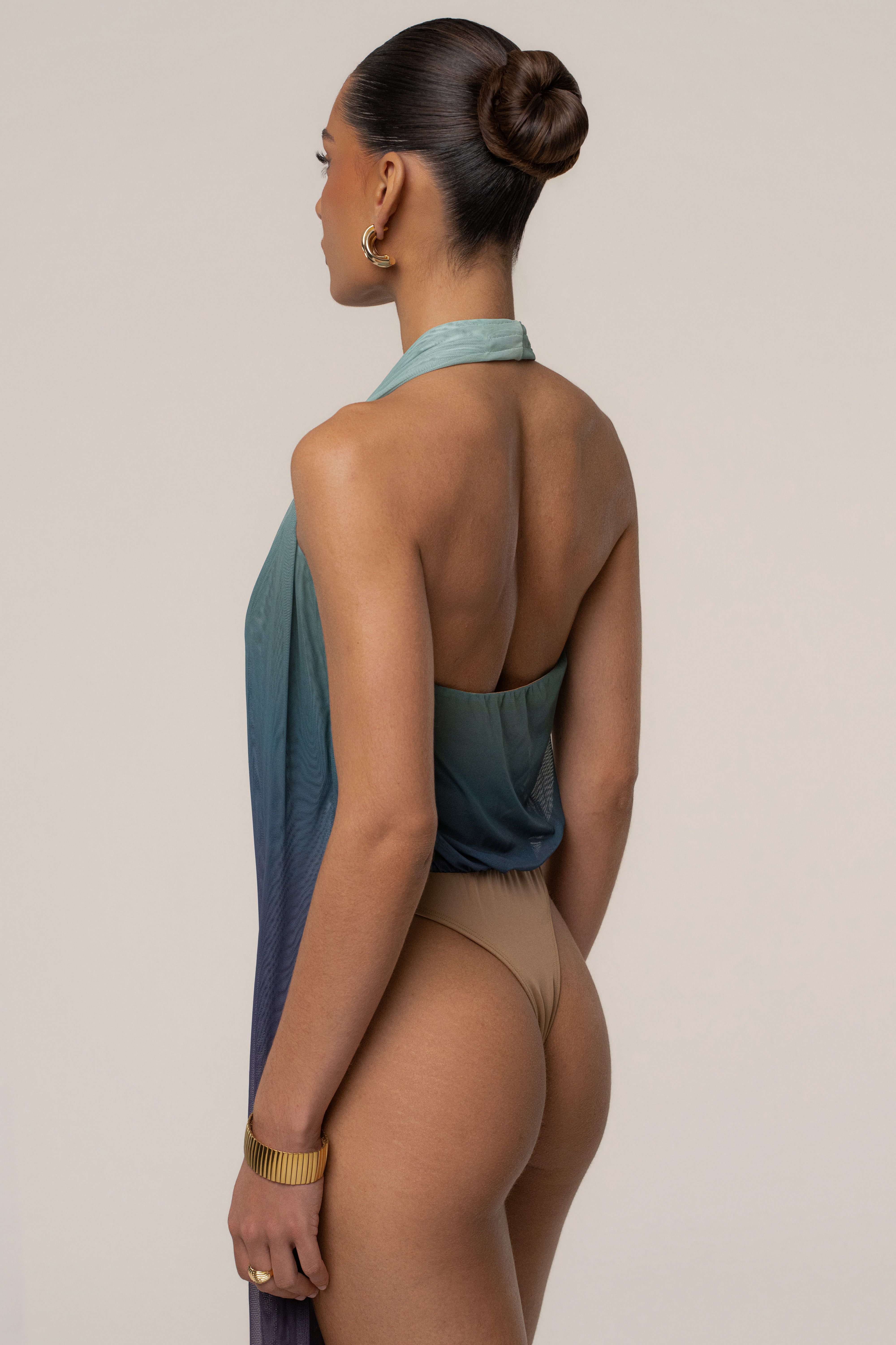 JLUXLABEL Lunar Shadow Bare Form plunge bodysuit, a sleek black top with a deep V neckline and fitted design.