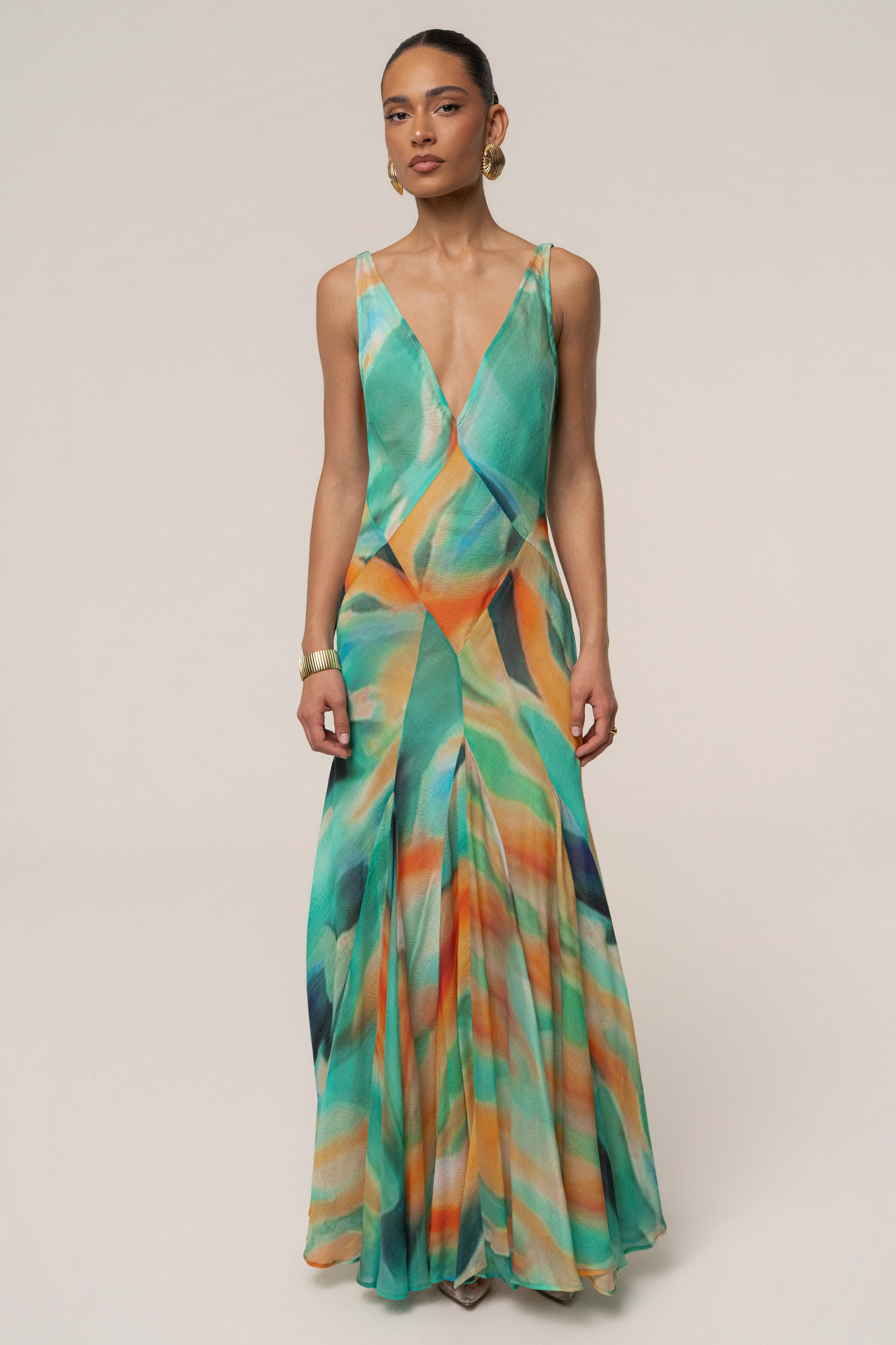 Green Prism Tide maxi dress by JLUXLABEL featuring a flowing silhouette and vibrant color, perfect for summer or formal occasions.