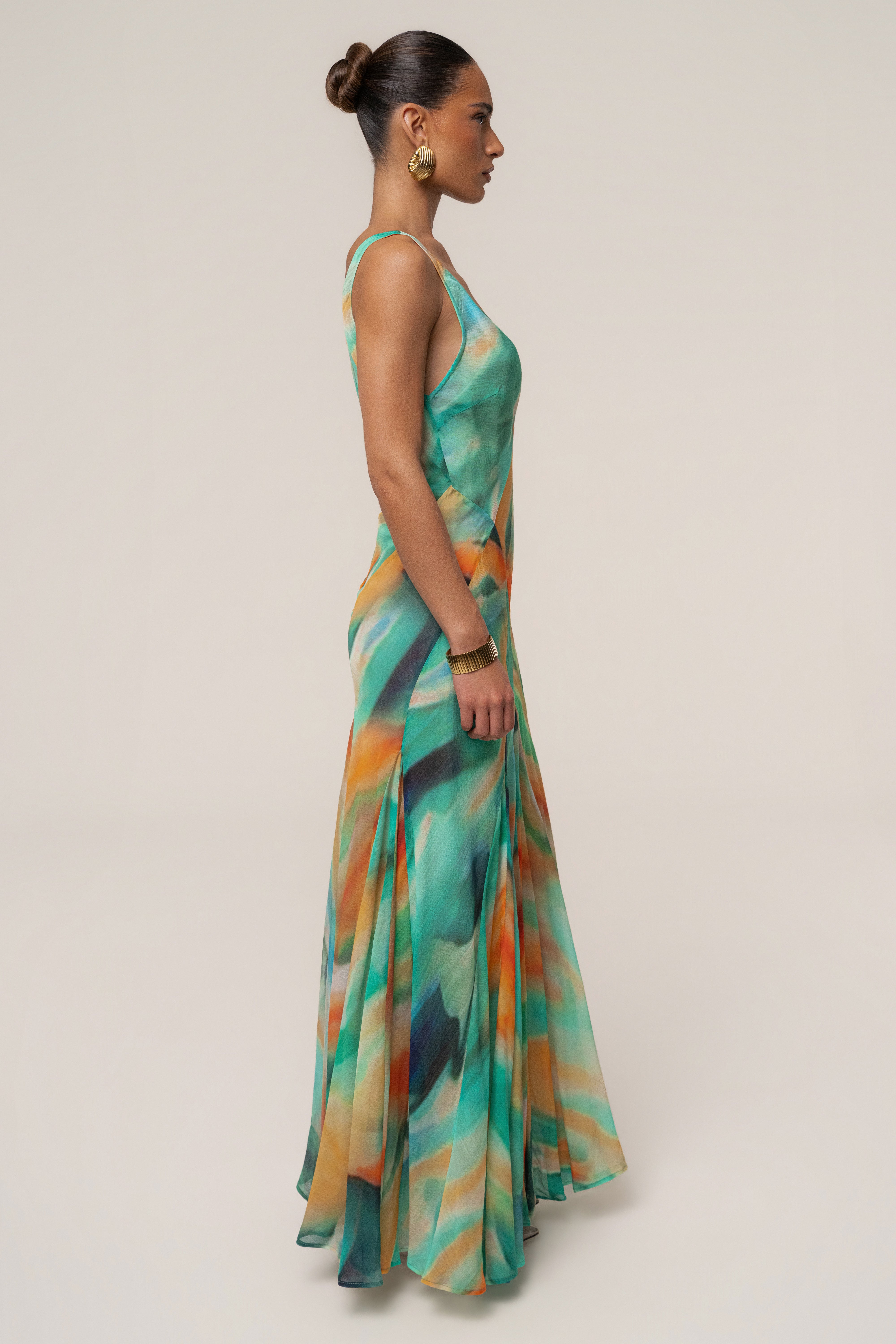 Green prism tide maxi dress by JLUXLABEL featuring a flowing silhouette and vibrant color, perfect for summer or special occasions.