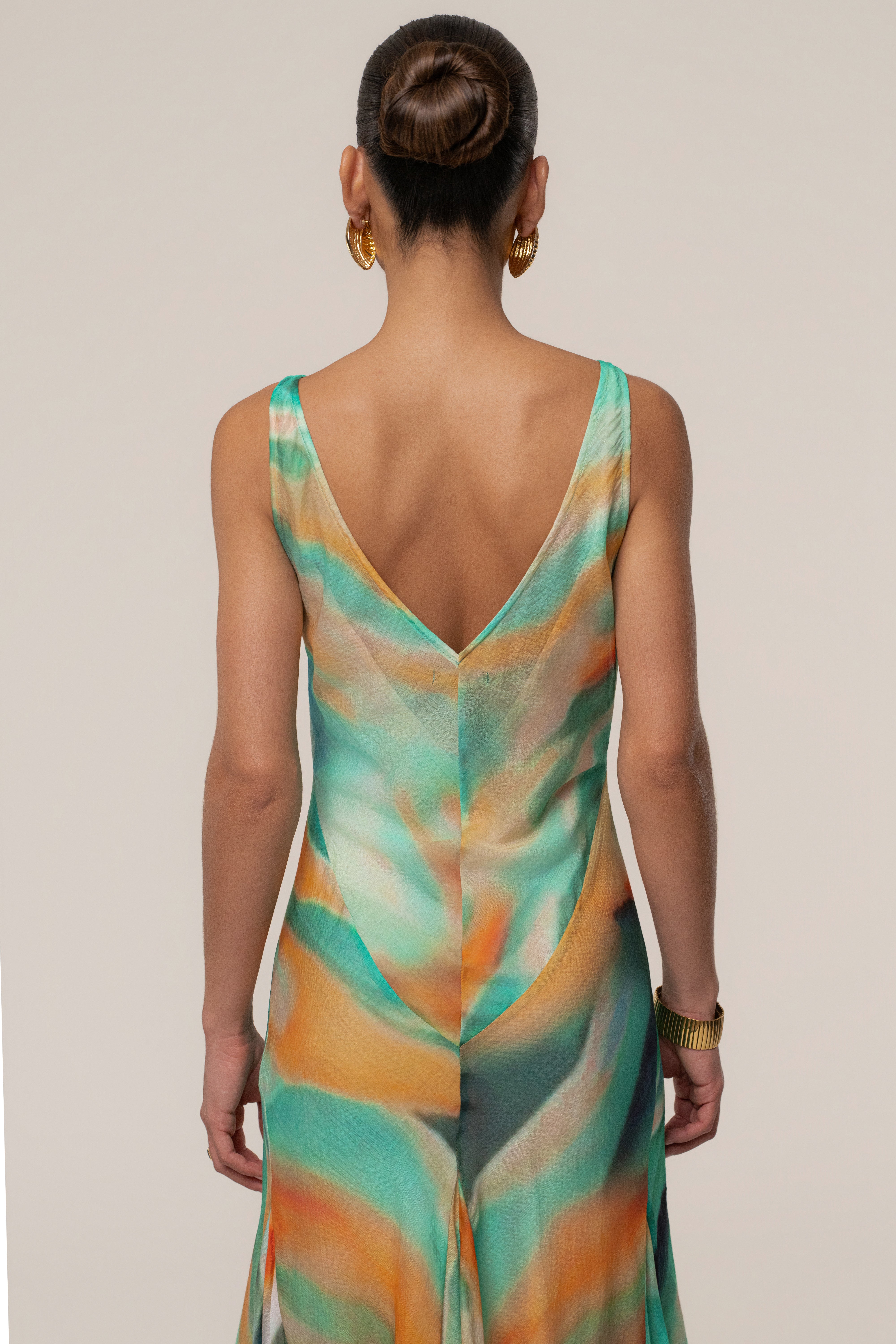 Green Prism Tide Maxi Dress by JLUXLABEL, featuring a flowing fabric and vibrant green color, perfect for stylish daytime wear.