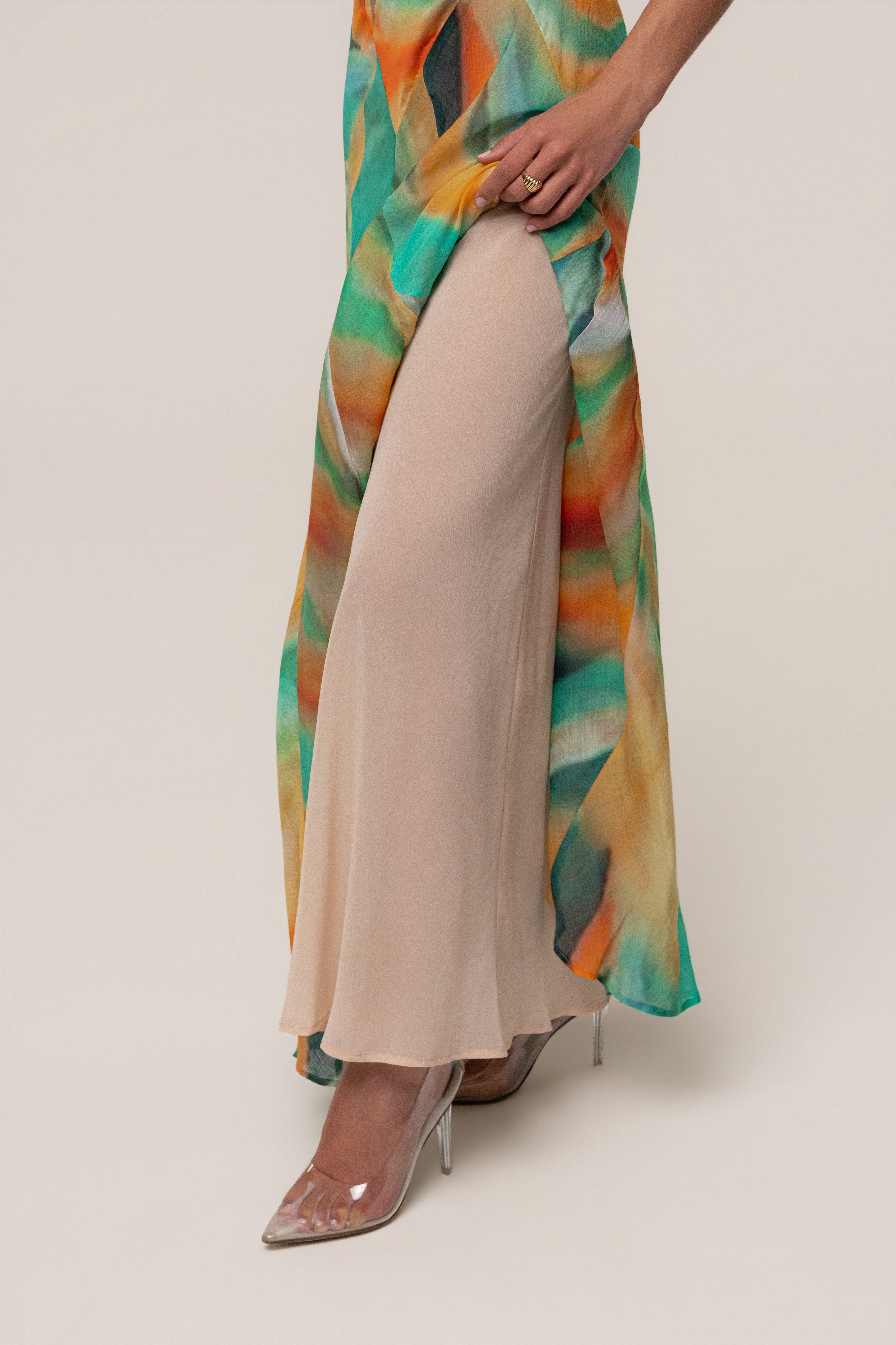 Green Prism Tide maxi dress by JLUXLABEL featuring a flowing silhouette and vibrant geometric pattern.