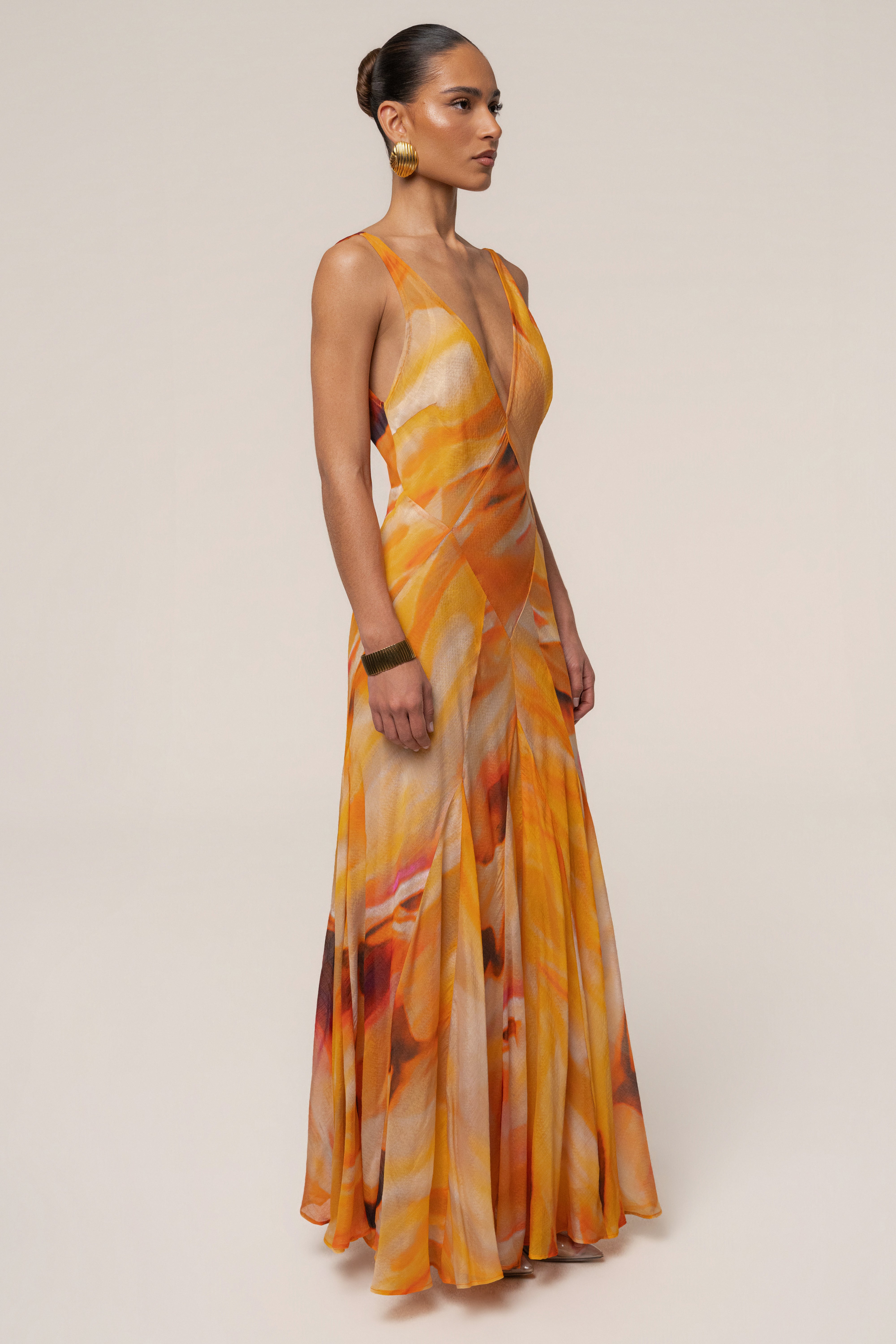 Yellow Prism Tide Maxi Dress by JLUXLABEL featuring flowing fabric and vibrant color, perfect for summer occasions.