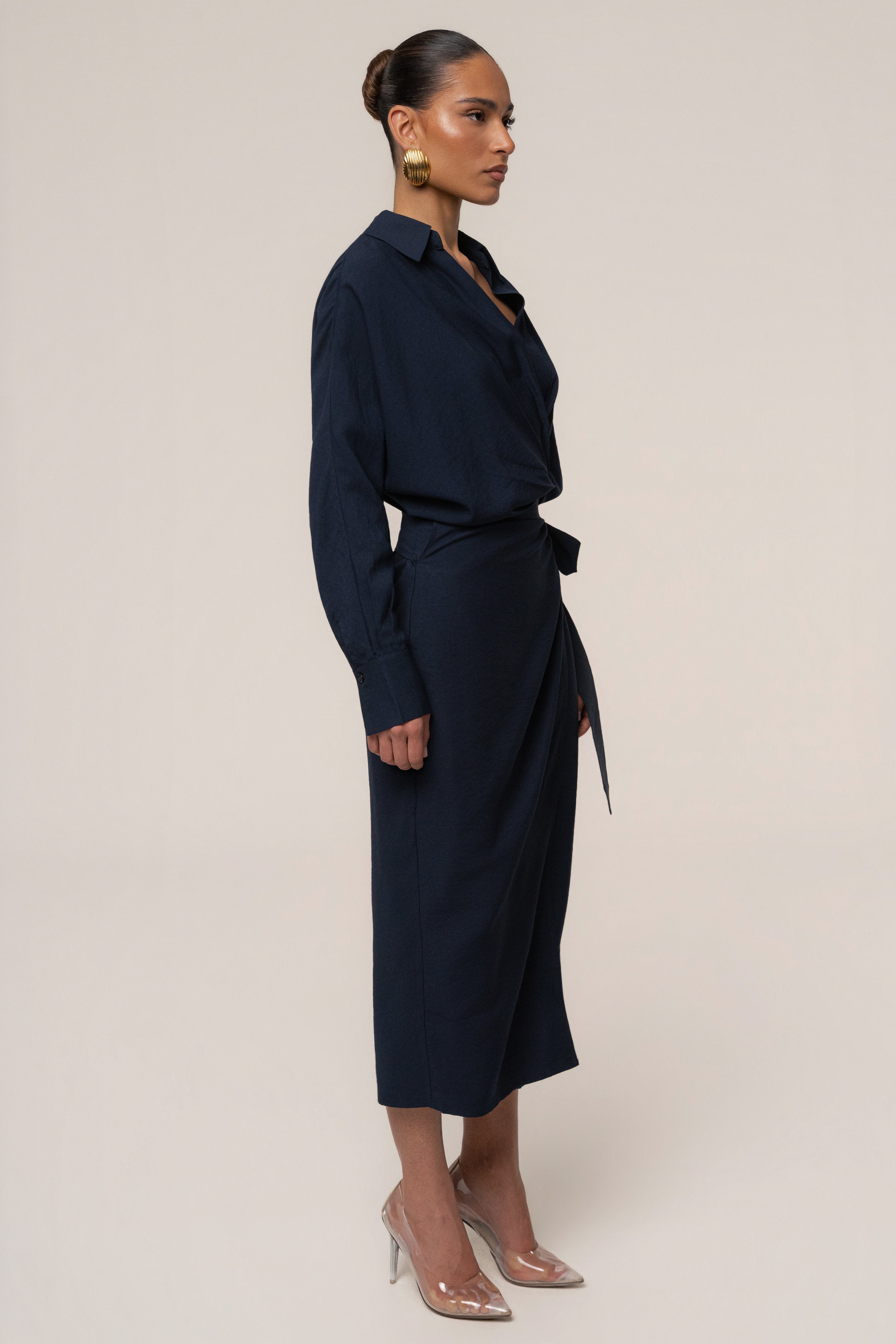 Navy Skyline Wrap Midi Dress by JLUXLABEL featuring a fitted waist and flowing skirt, perfect for elegant occasions.