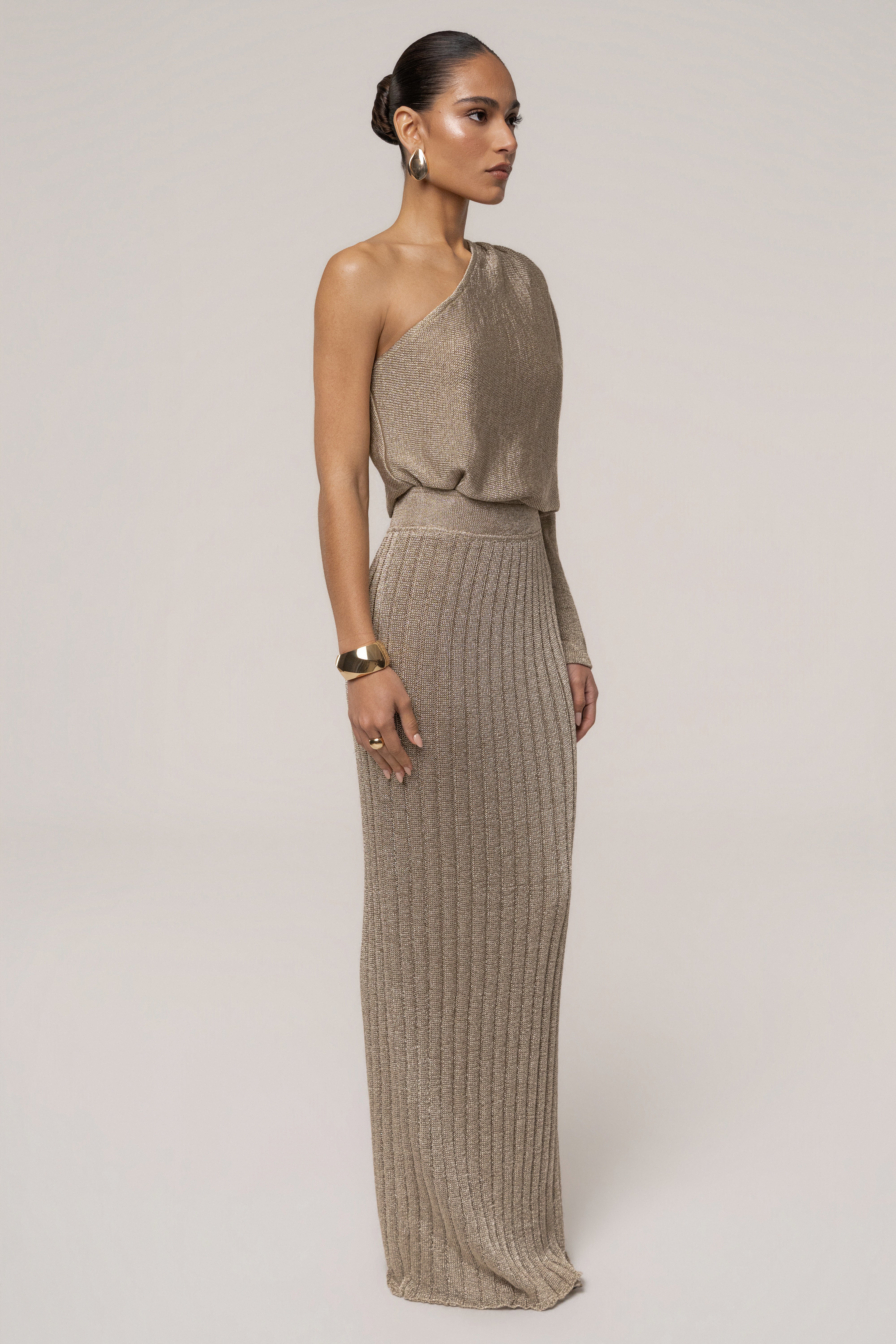 Gold metallic bodysuit from JLUXLABEL featuring a fitted design and sleek metallic finish, styled as a fashionable top.