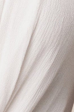 White Tulum Drape Top by JLUXLABEL, featuring a flowy fabric and stylish draped design, shown on a model.