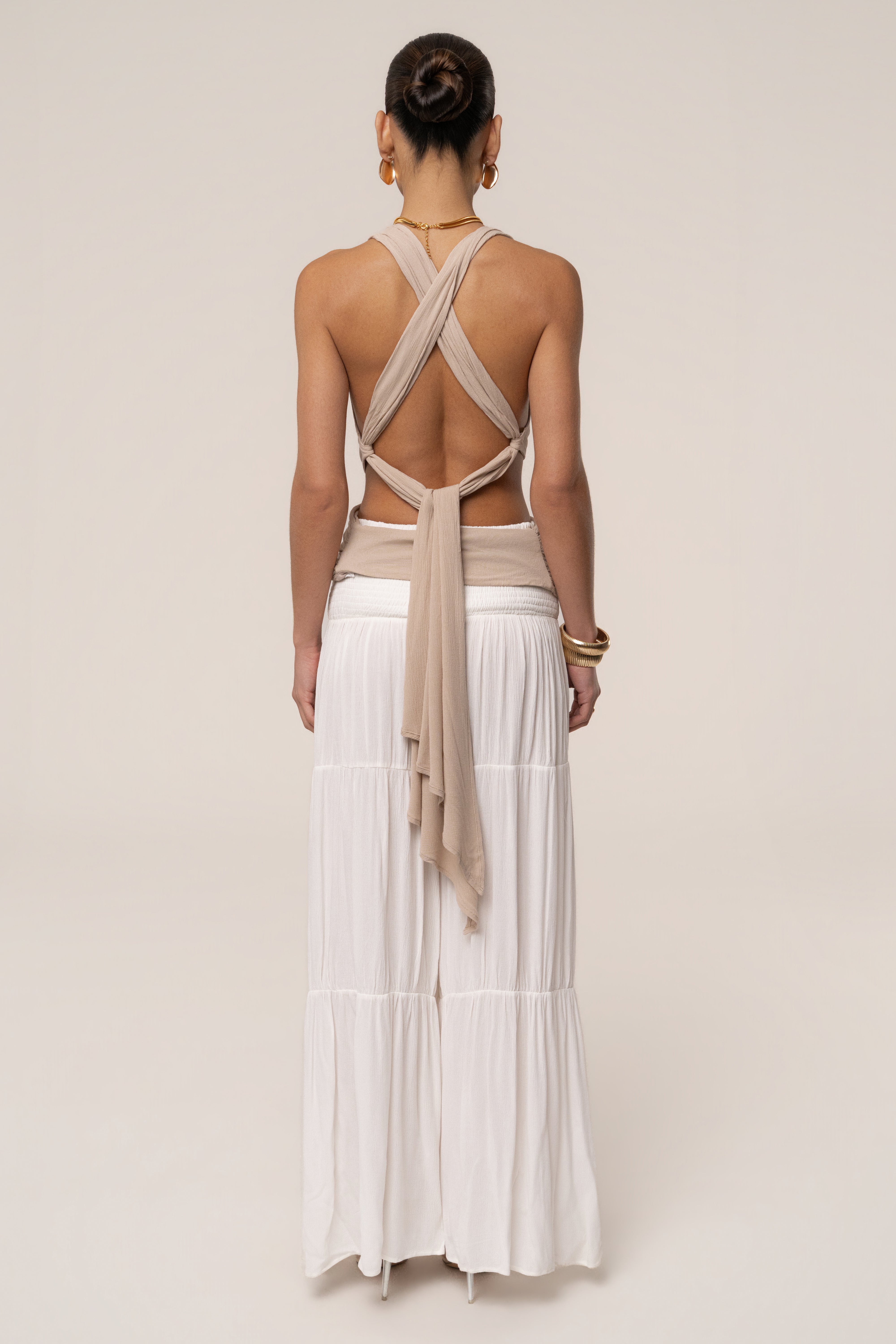 Beige Tulum Drape Top from JLUXLABEL, showcasing its flowy fabric, draped design, and relaxed fit ideal for casual wear.