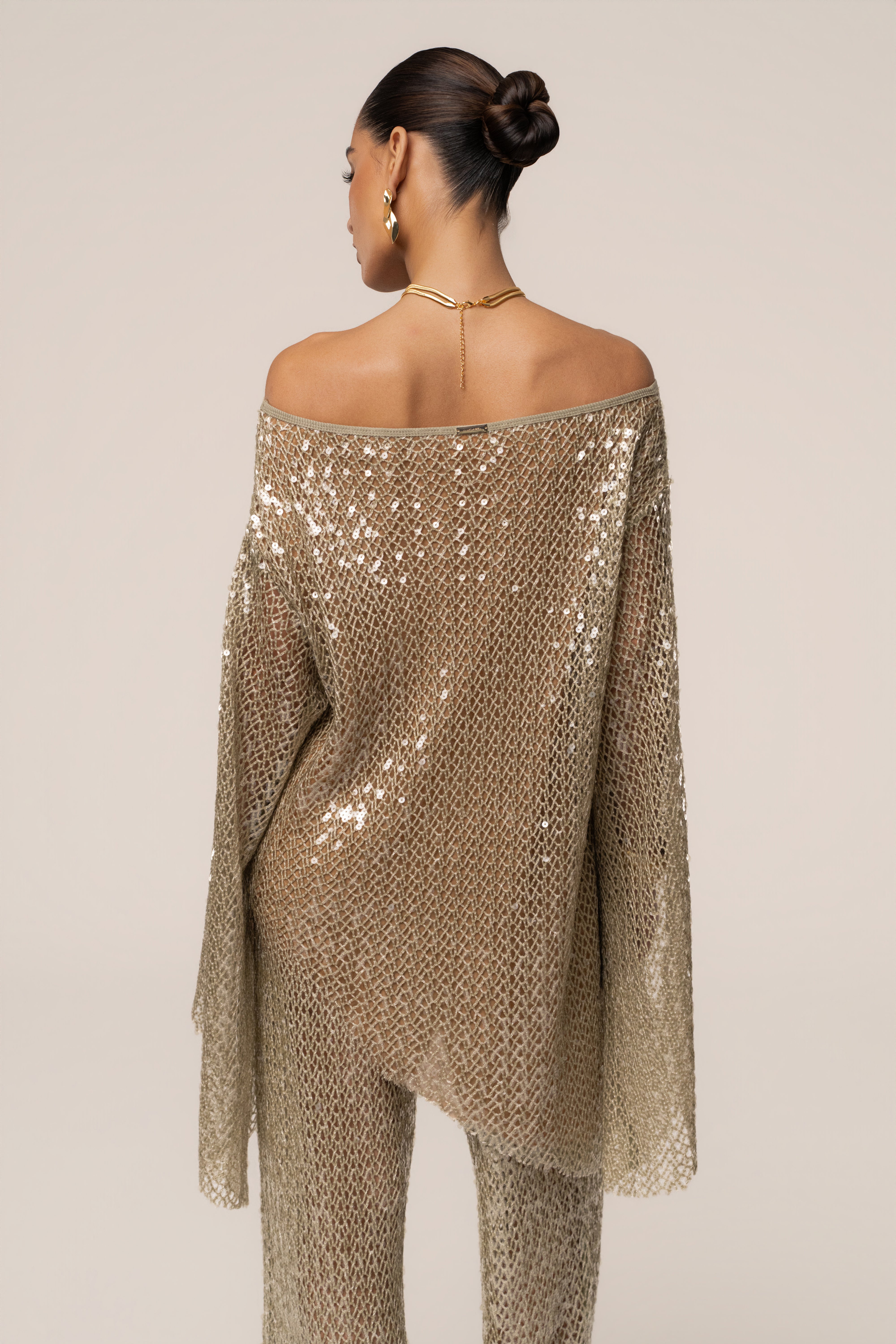 JLUXLABEL Sage Sheer Glow Sequin Top, stylish semi-transparent sleeveless blouse with shimmering sequin details.