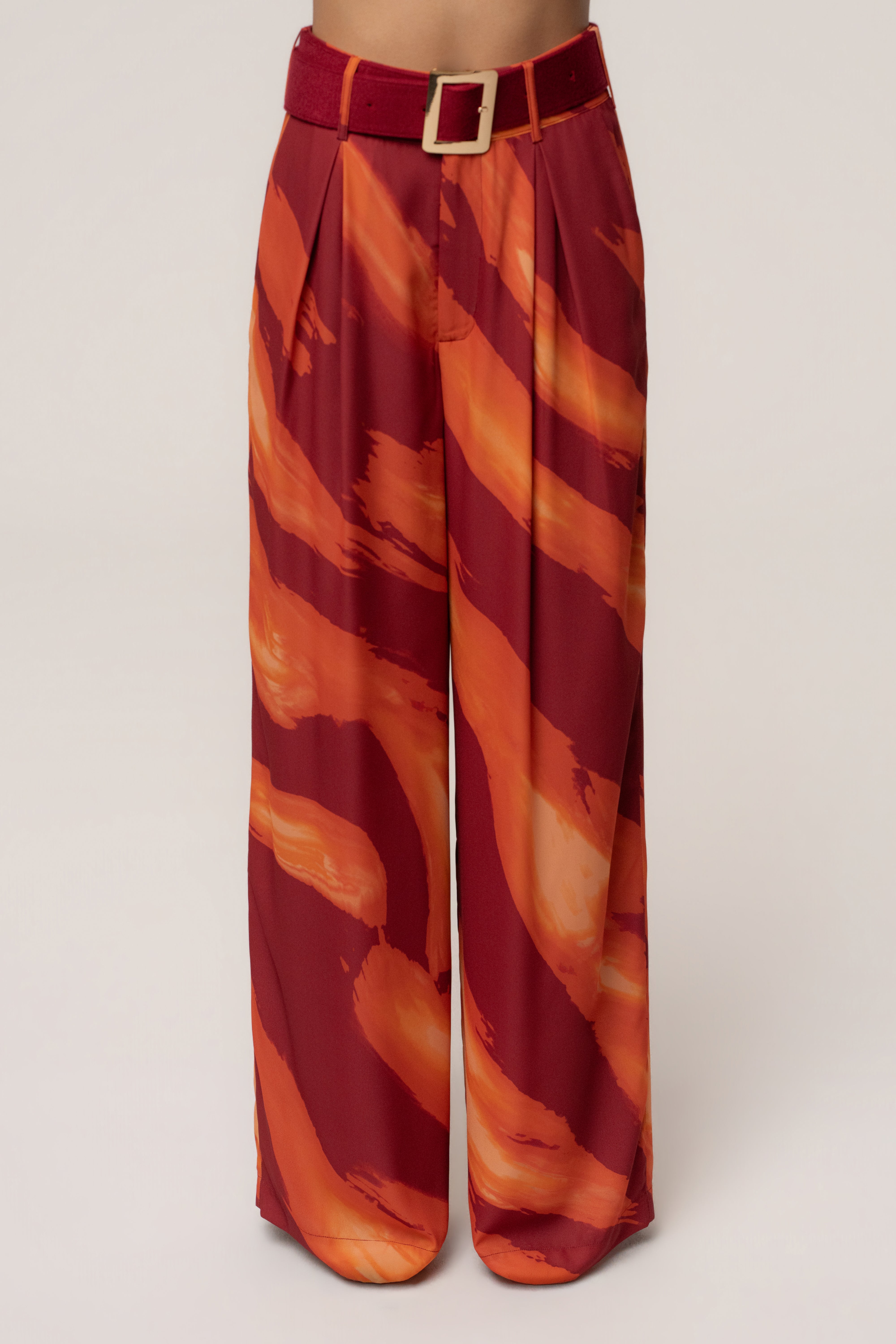 Crimson Dusk JLUXLABEL soft pleated trousers, stylish bottoms with a relaxed fit and tailored pleats, displayed on a model.