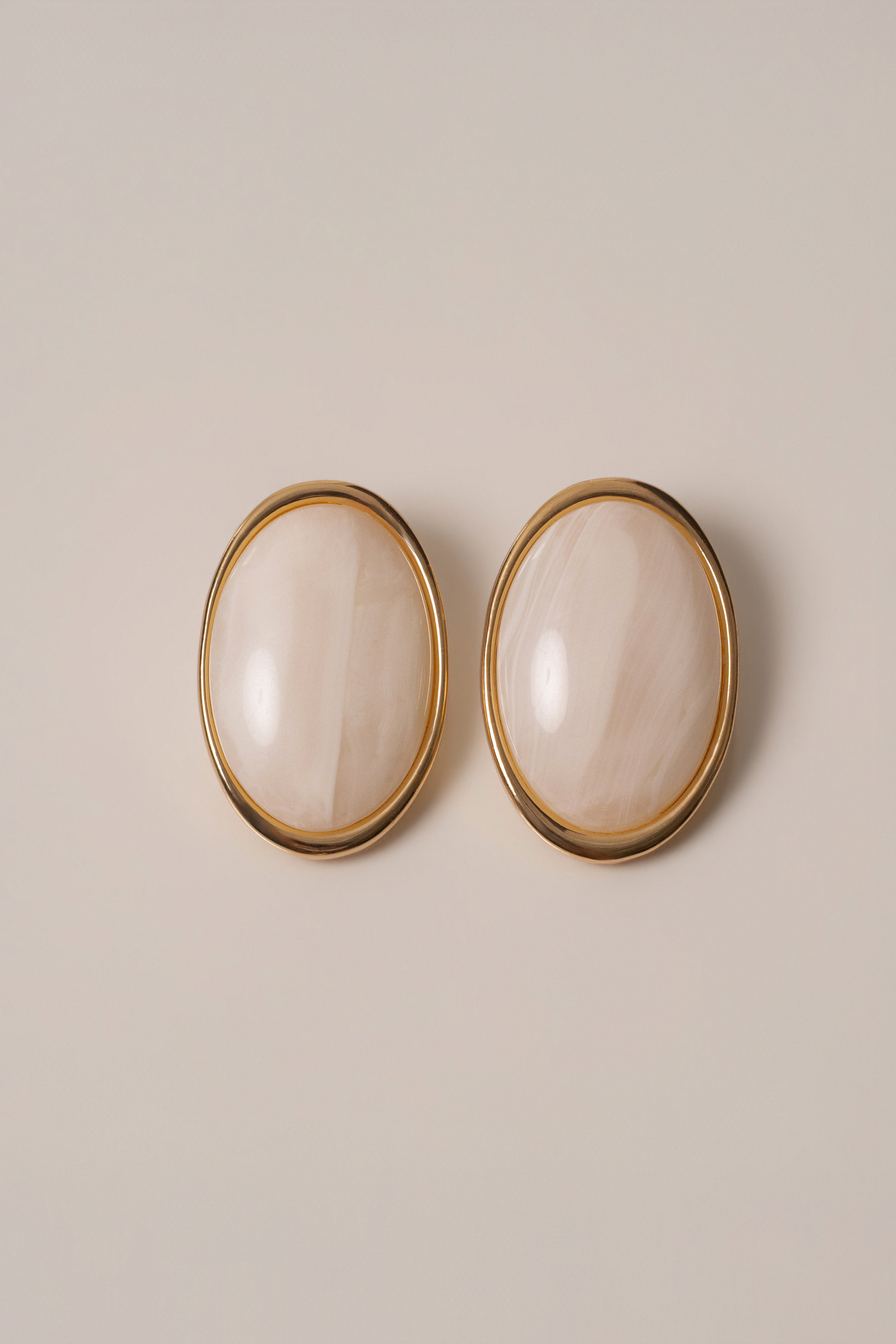 Ivory Alessia oval earrings by JLUXLABEL featuring elegant jewelry design with smooth oval shapes and gold-tone accents.
