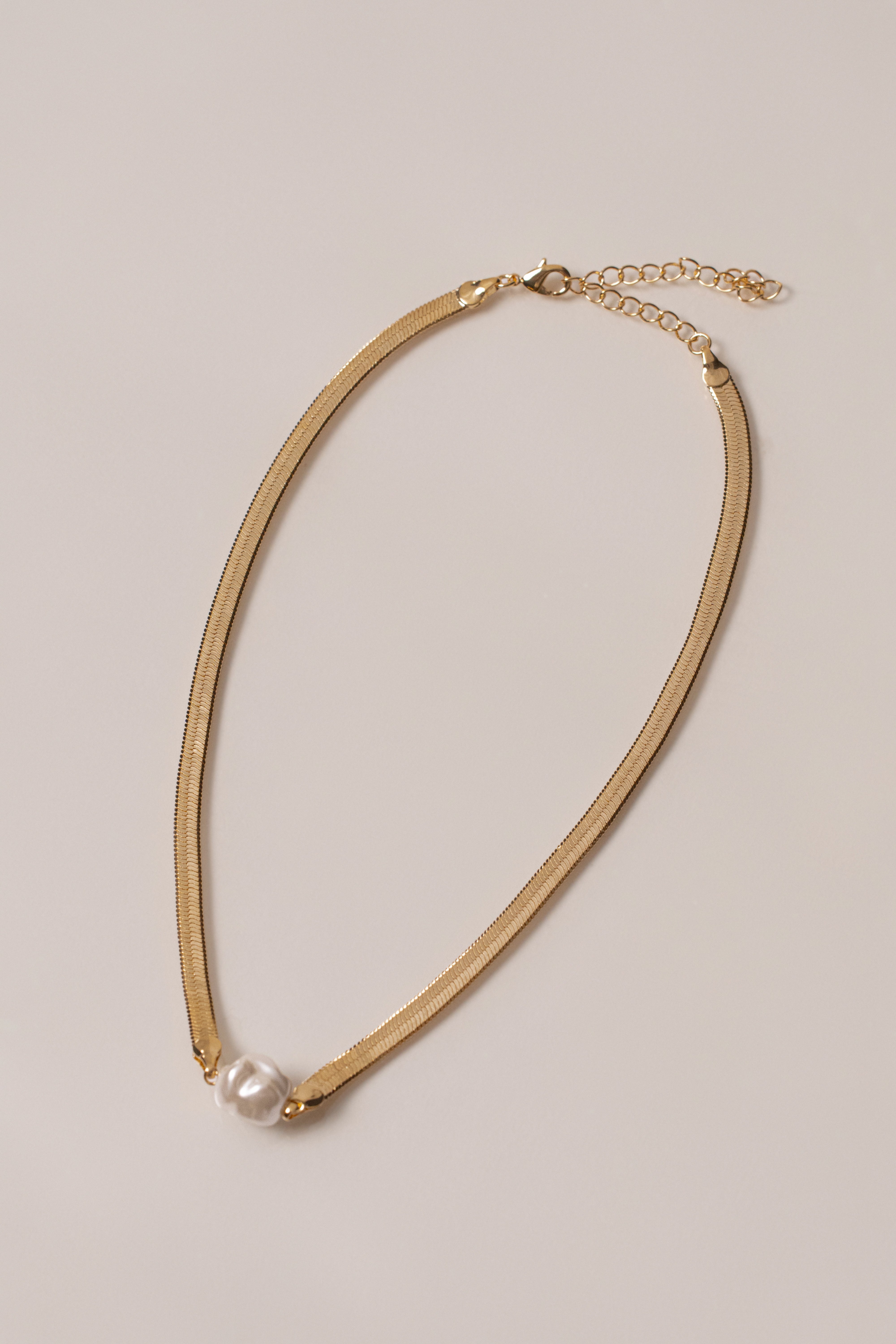 Gold pearl herringbone necklace from JLUXLABEL featuring a sleek, elegant chain with lustrous pearls for sophisticated style.