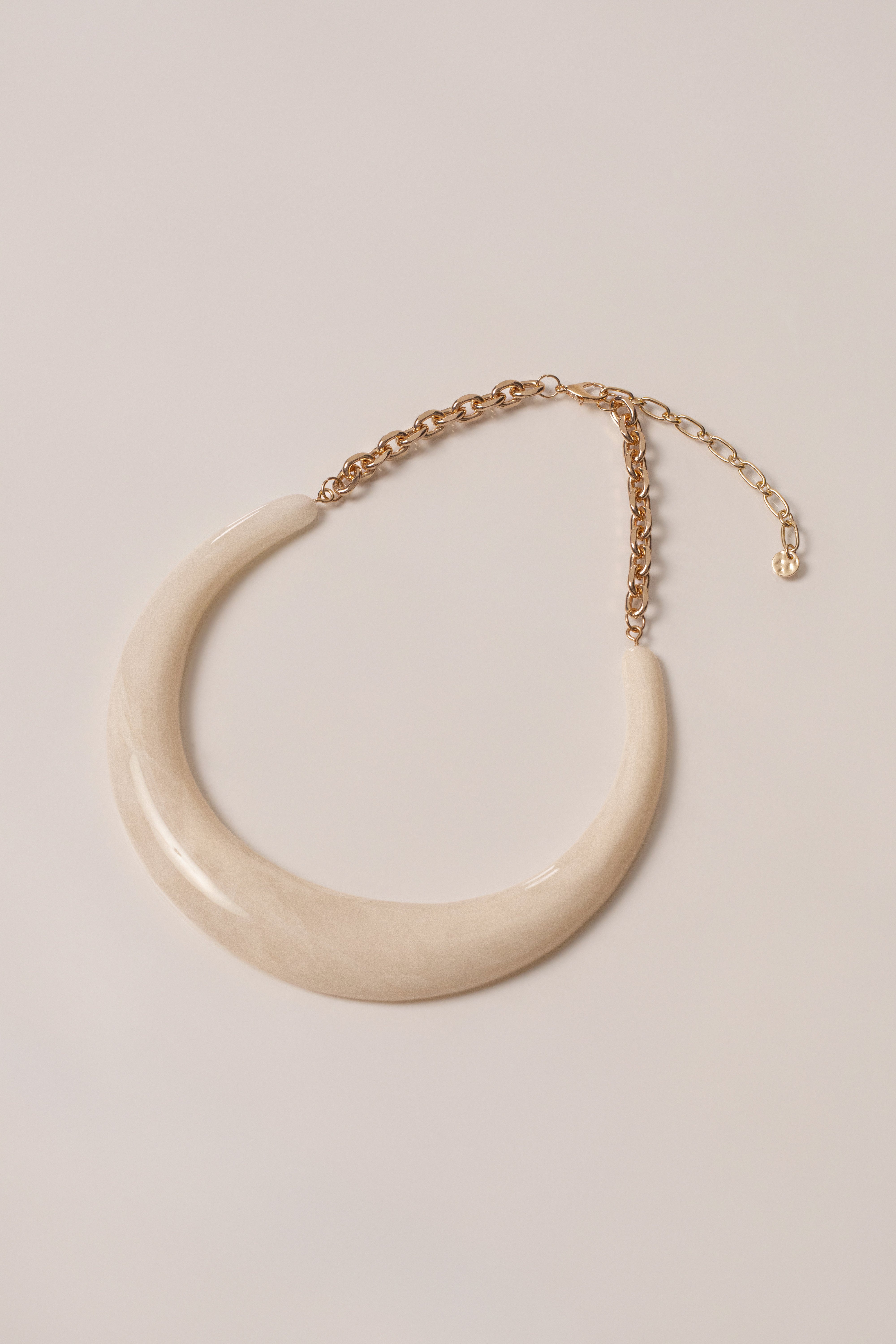 Ivory opaline collar necklace by JLUXLABEL featuring a smooth, rounded jewelry design on a white background