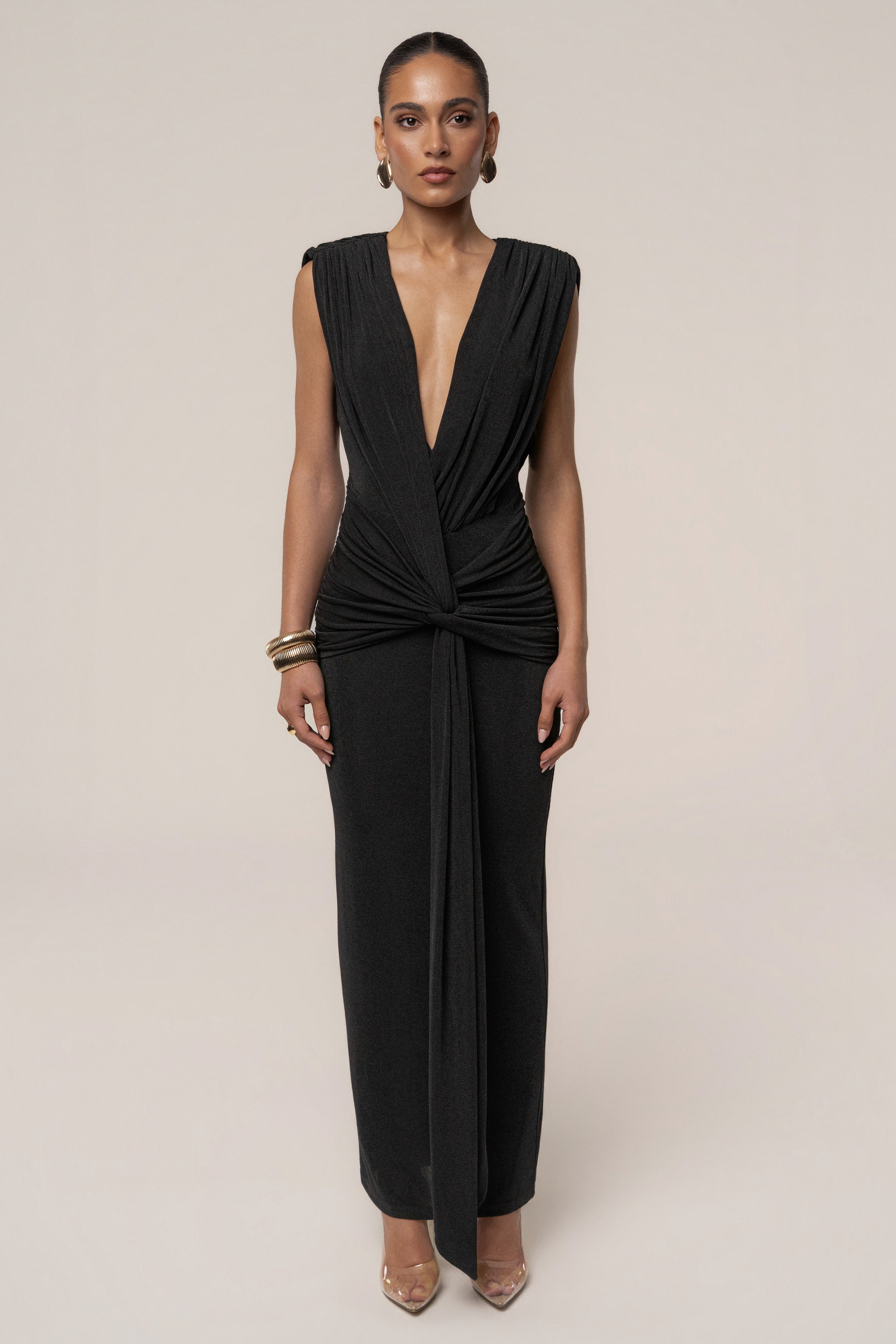 Black Palma Plunge Maxi Dress by JLUXLABEL, featuring a deep V neckline and flowing fabric, displayed on a mannequin.