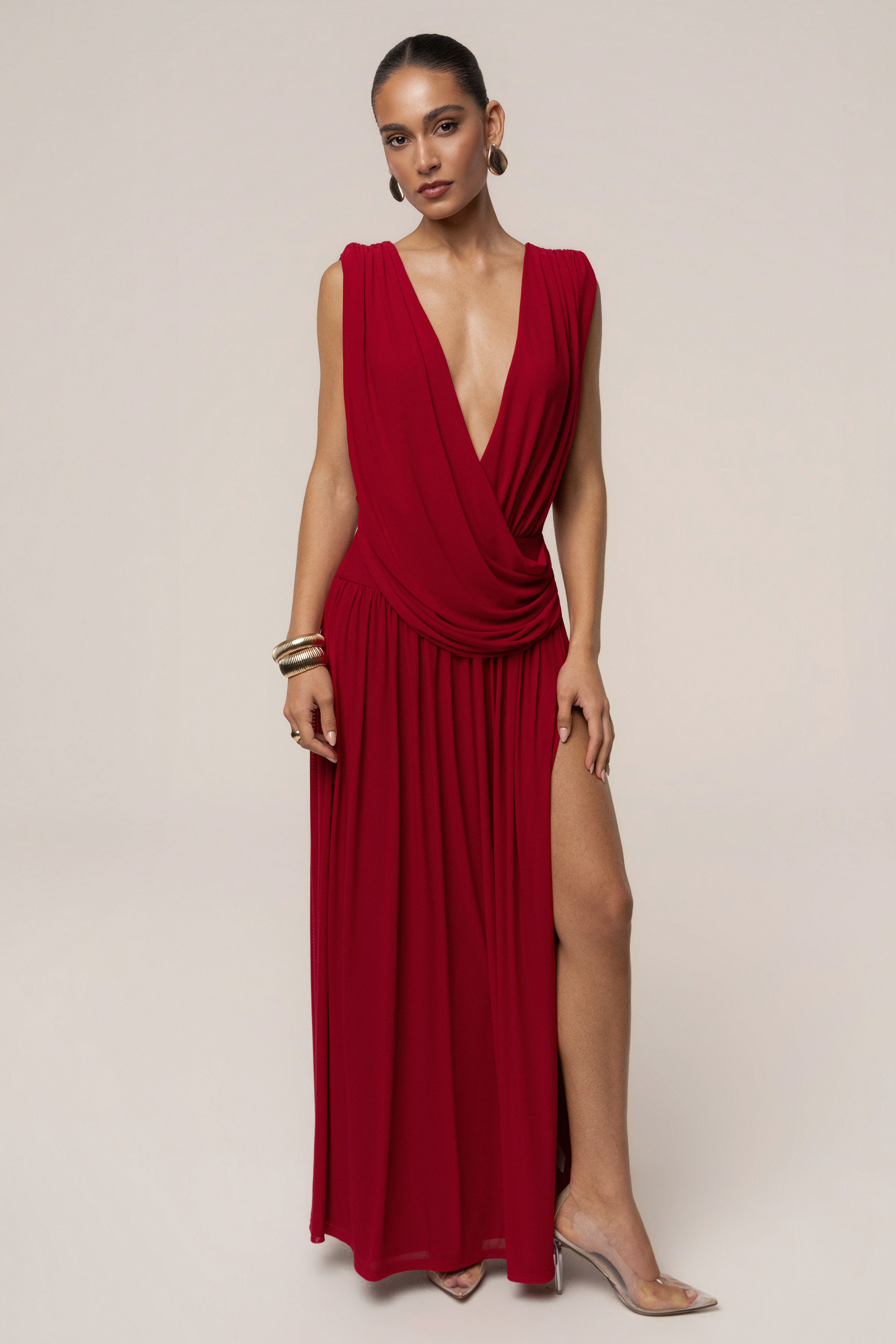 Red evening flow draped maxi dress by JLUXLABEL, showcasing a elegant, floor-length dress with a flowing silhouette and draped fabric.