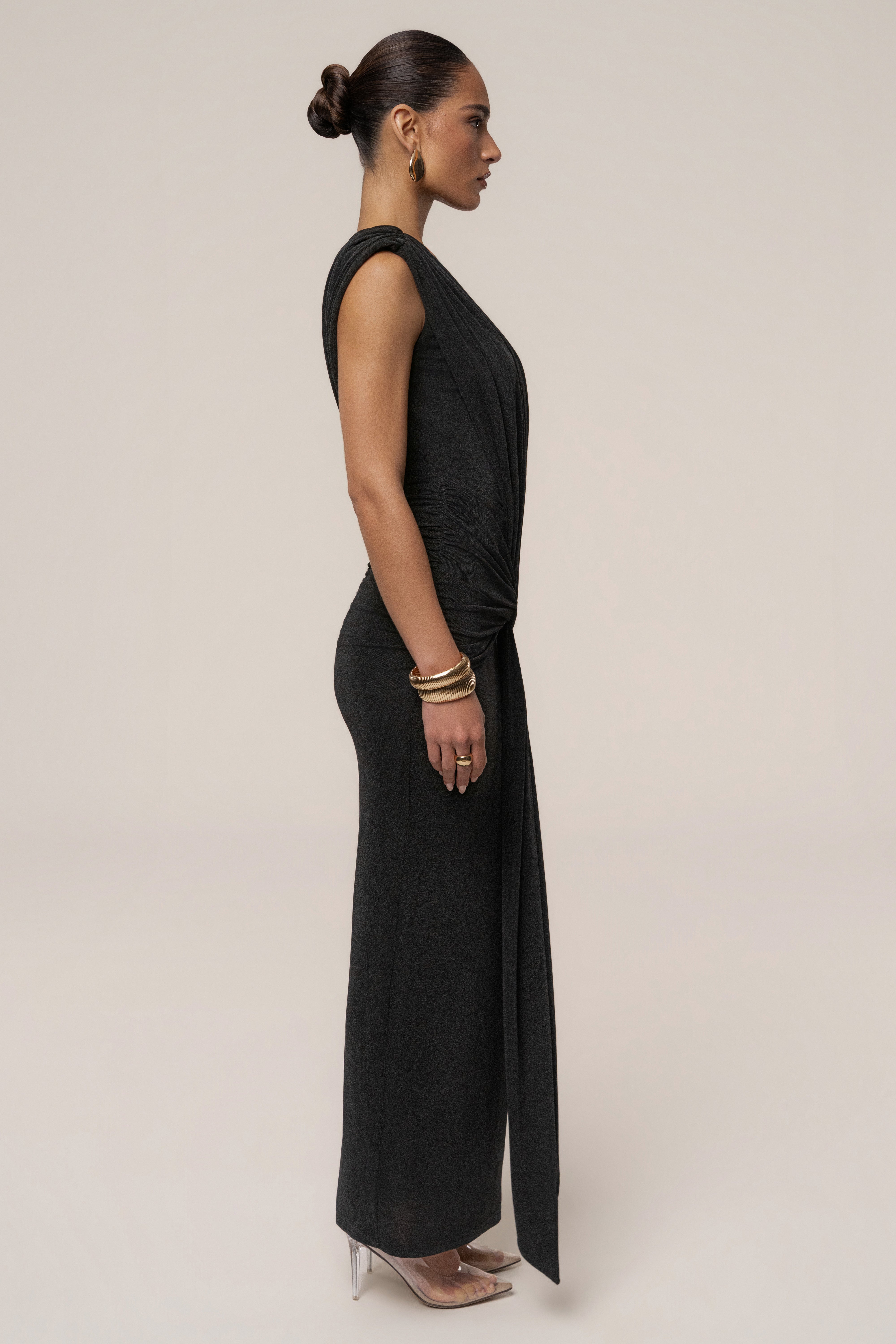 Black Palma Plunge Maxi Dress by JLUXLABEL, featuring a deep V neckline and flowing silhouette, perfect for elegant occasions.