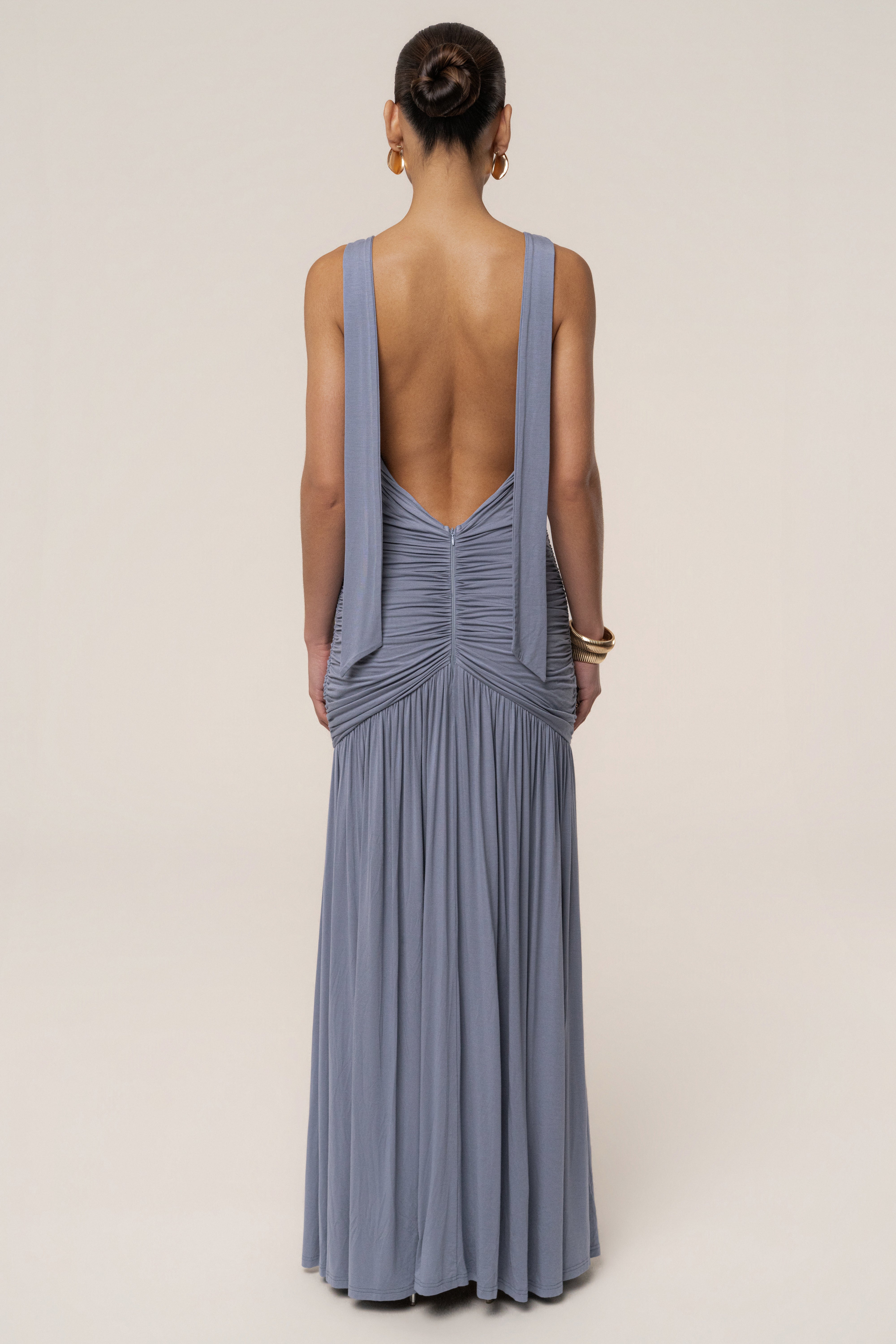 Blue and gold halter dress by JLUXLABEL featuring elegant design and flowing fabric, perfect for evening occasions.