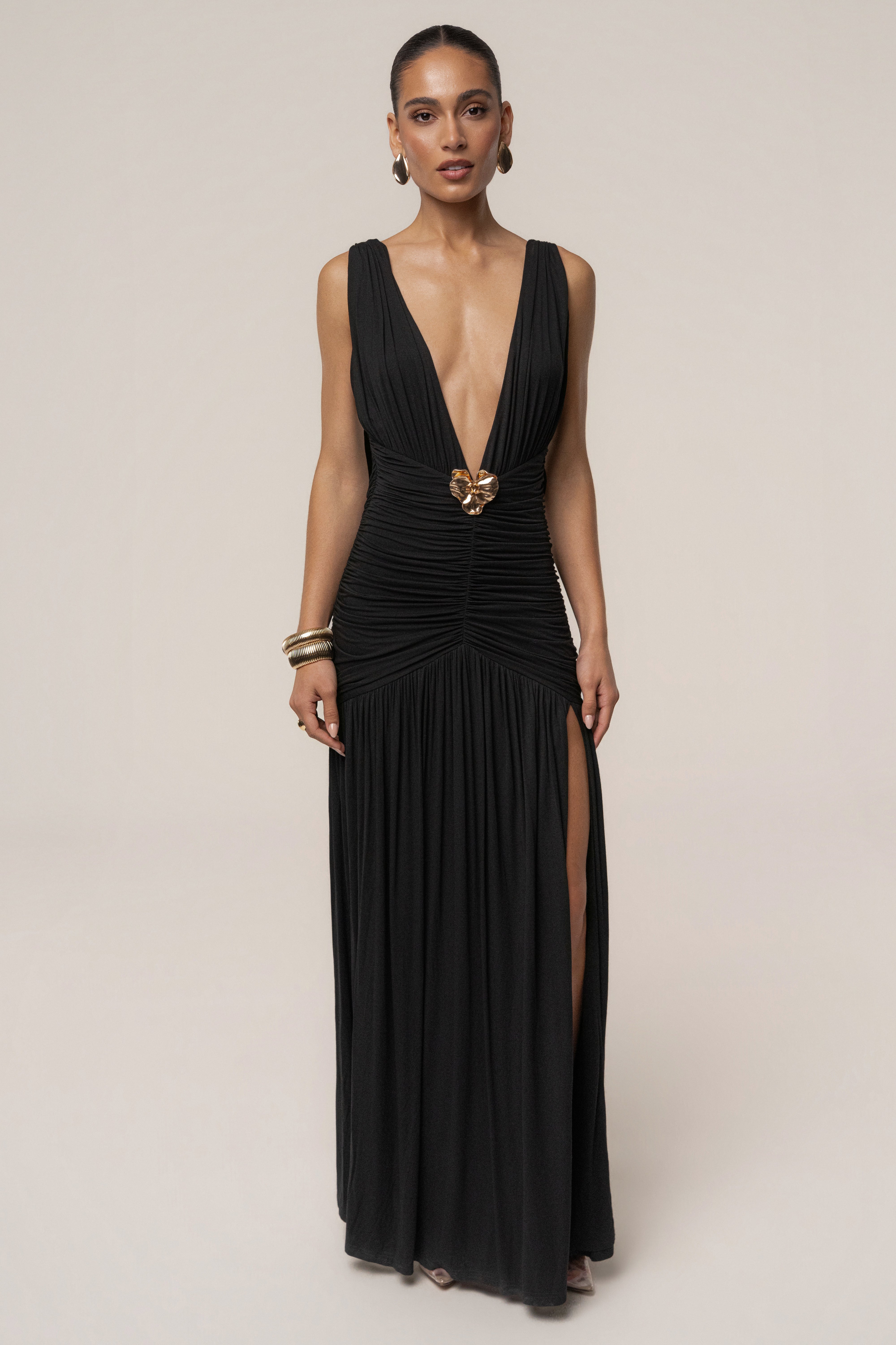 Black and gold halter evening dress by JLUXLABEL featuring a fitted silhouette and elegant design, suitable for formal occasions.