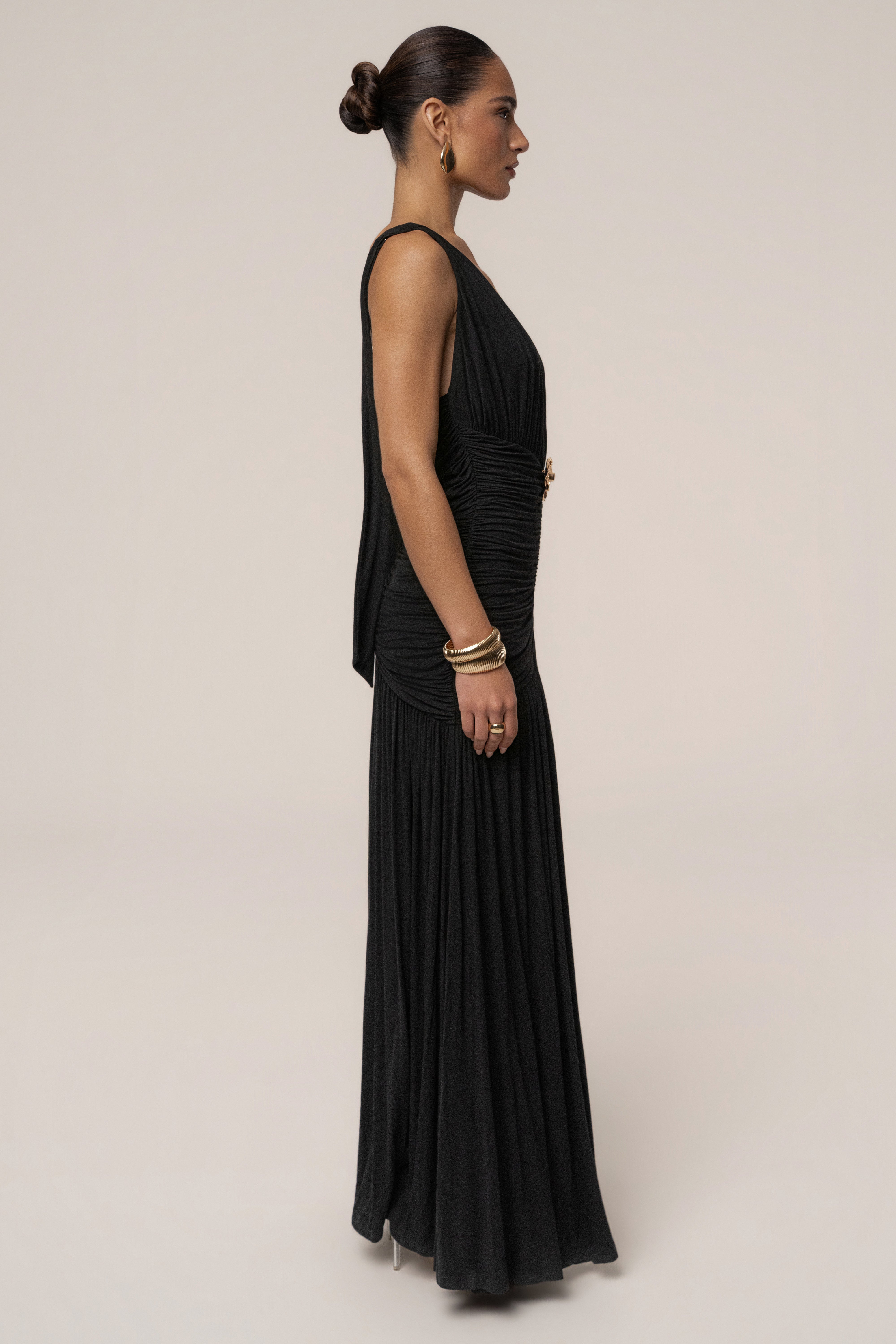 Black and gold halter evening dress by JLUXLABEL featuring a fitted design and elegant neckline for formal occasions.