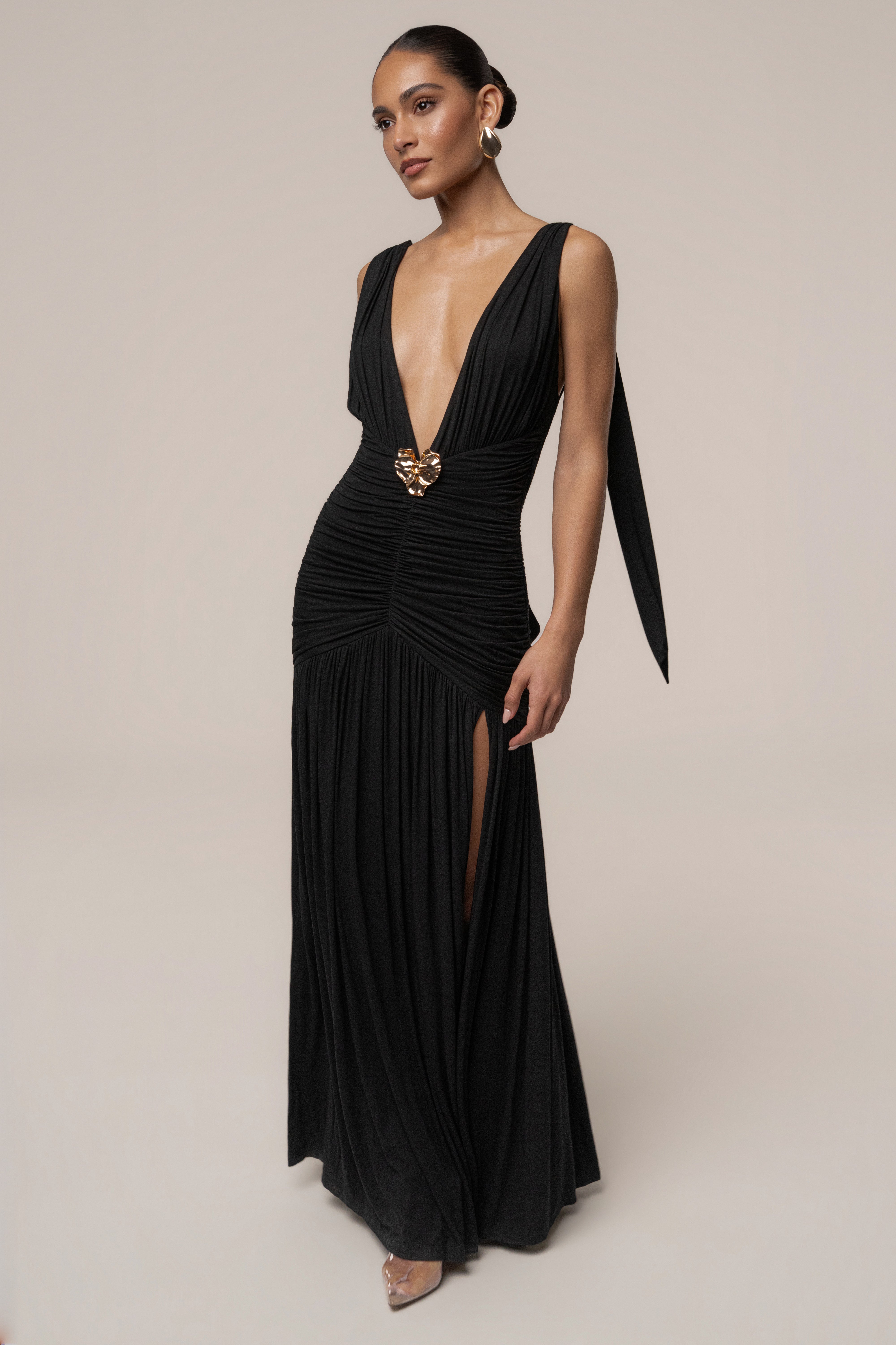 Black and gold halter evening dress by JLUXLABEL featuring a fitted silhouette and elegant design for special occasions.