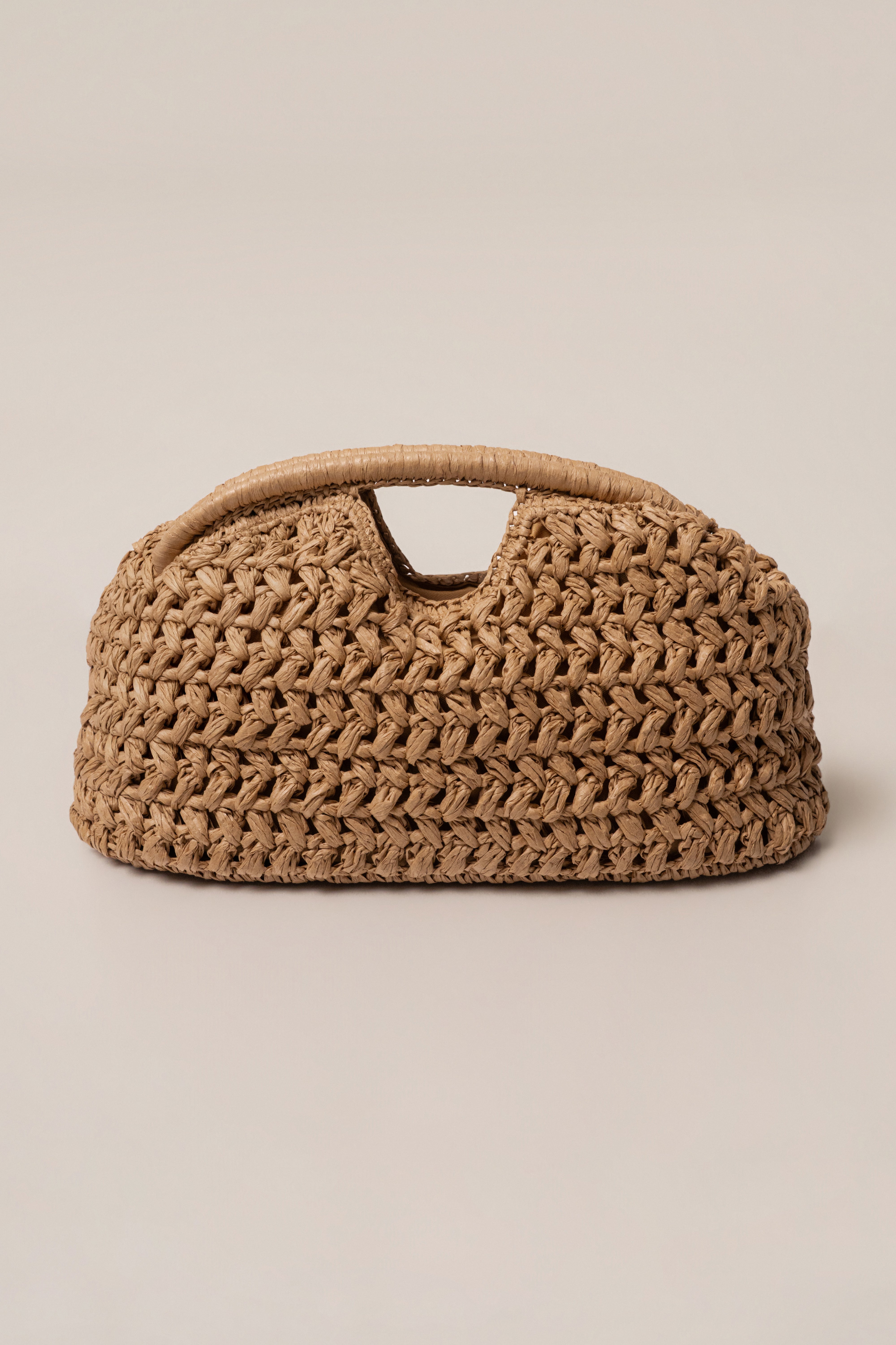Natural Casa Sol straw bag by JLUXLABEL, woven accessory with leather handles, perfect for casual summer style.