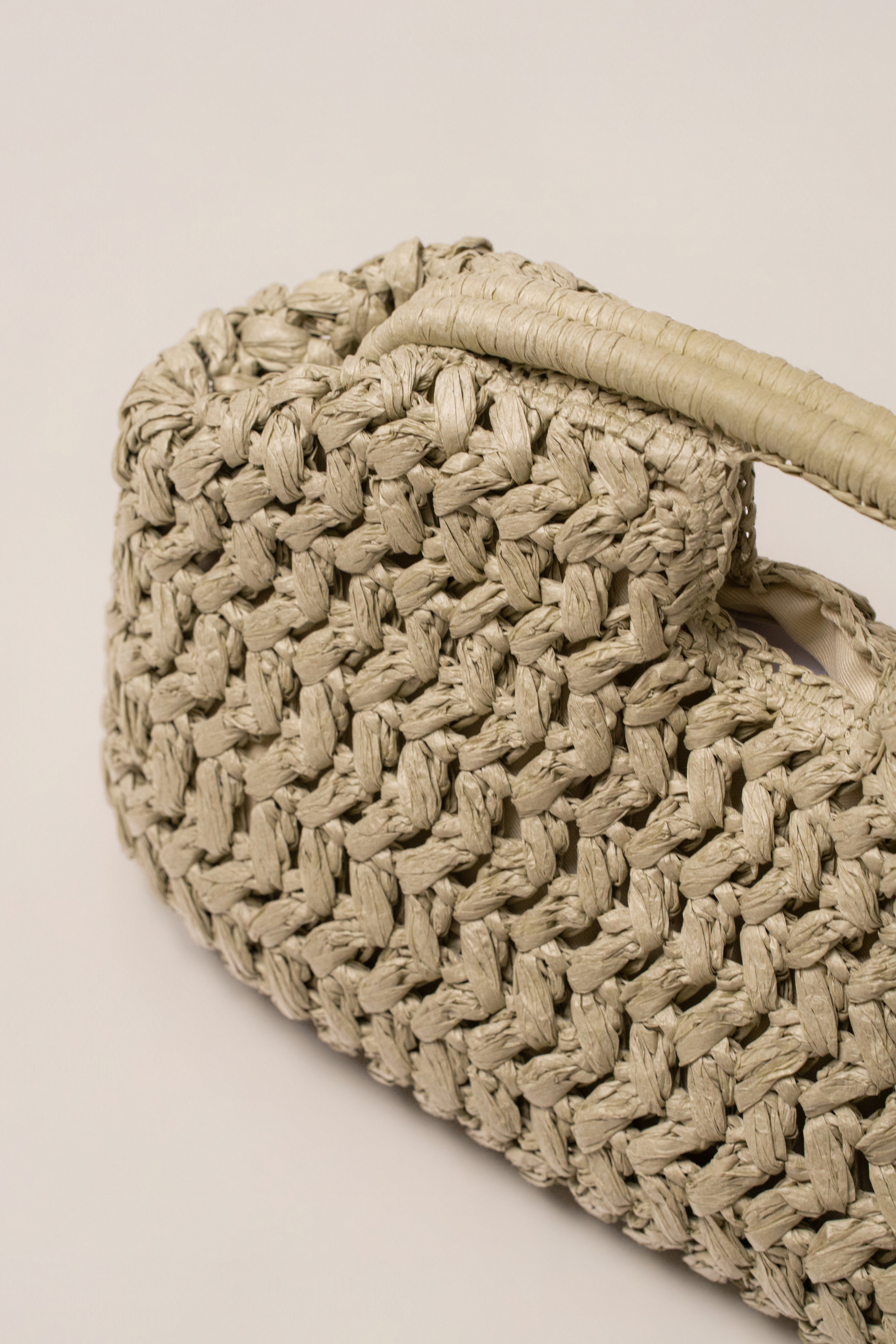 JLUXLABEL Sage Casa Sol straw bag, boho accessories with woven design and leather straps, perfect for summer styling.