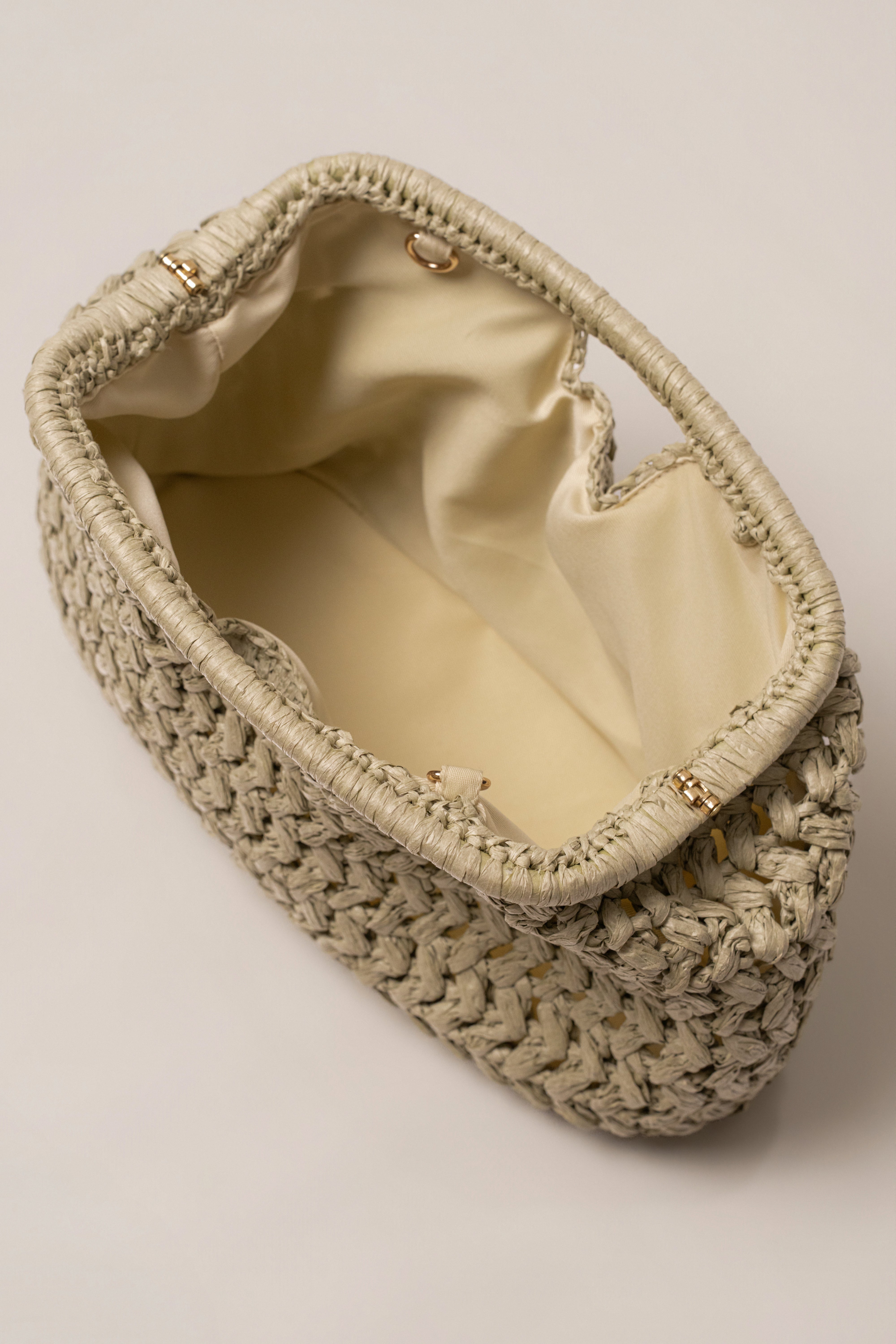 Sage Casa Sol straw bag by JLUXLABEL, eco-friendly accessories with woven texture and shoulder strap, perfect for summer style.