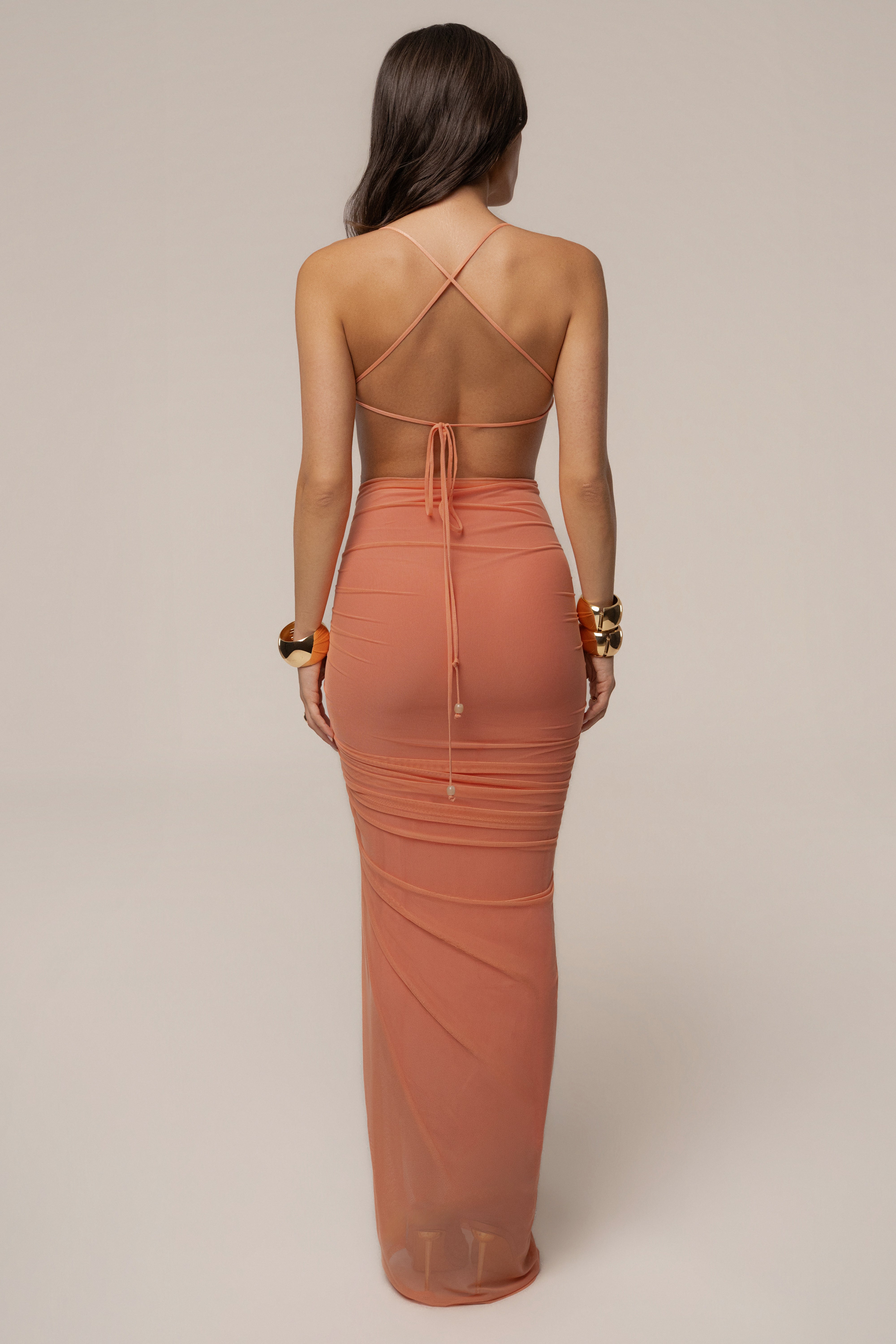 Peach Sunshine Coast Maxi Dress by JLUXLABEL, flowing sleeveless dress with a relaxed fit and floral pattern on lightweight fabric.