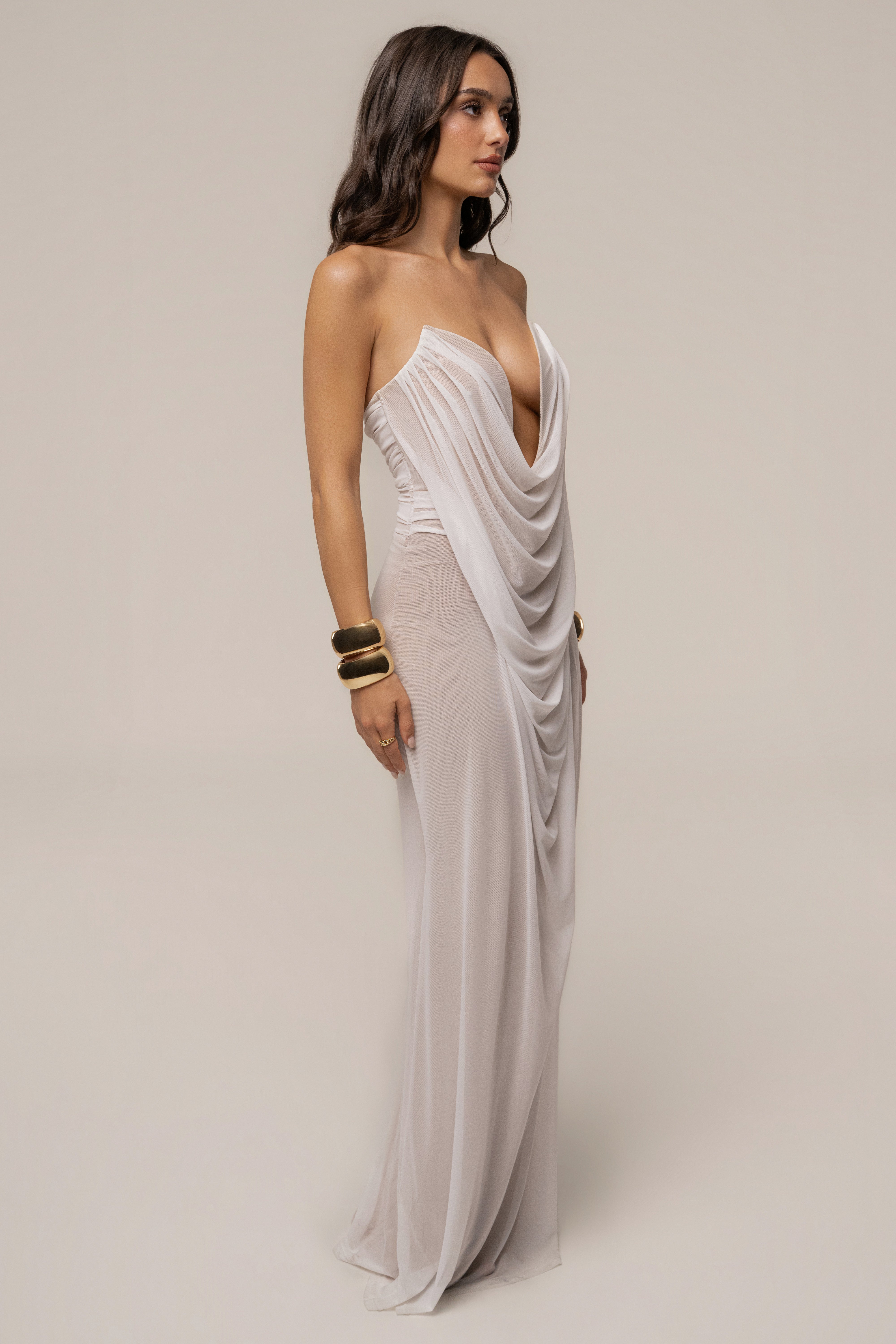 Ivory Siren Sculpted Mesh Dress by JLUXLABEL, featuring a fitted design with intricate mesh details and a sleek, elegant silhouette.
