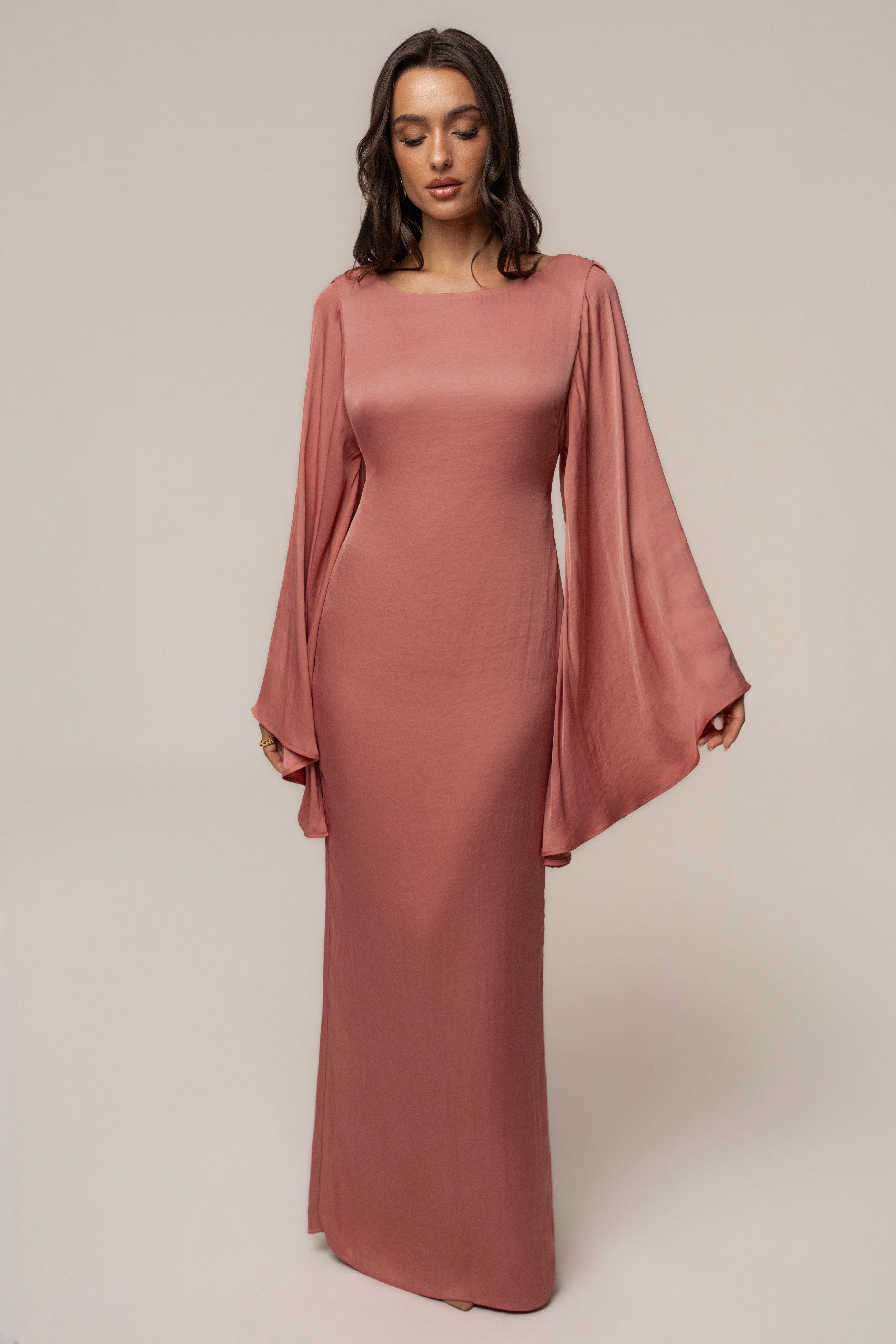 Peach soft current maxi dress by JLUXLABEL featuring flowing fabric and a stylish, elegant design.