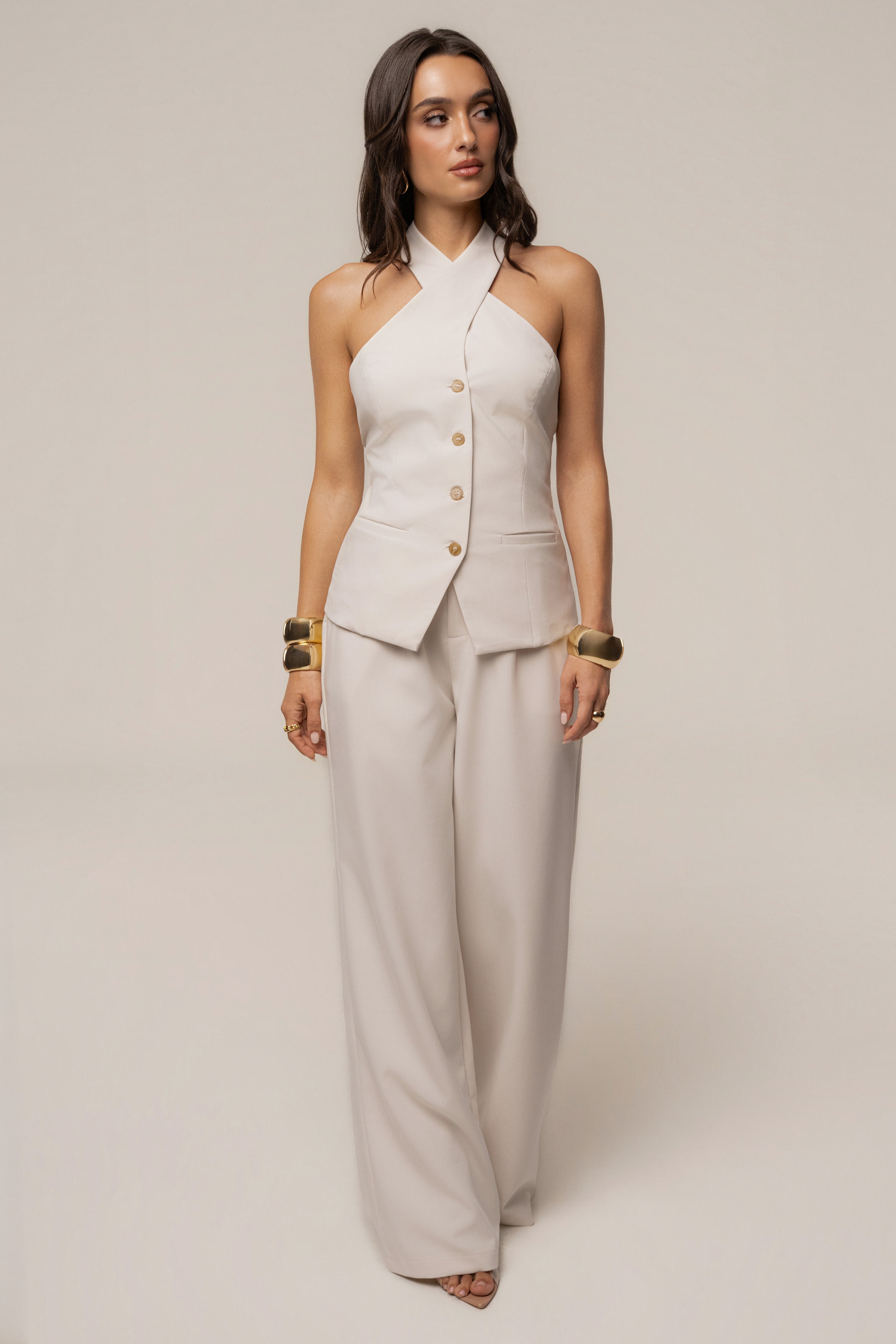 Ivory Fernanda halter top by JLUXLABEL, showcasing a stylish sleeveless design with a high neckline and elegant fabric details.