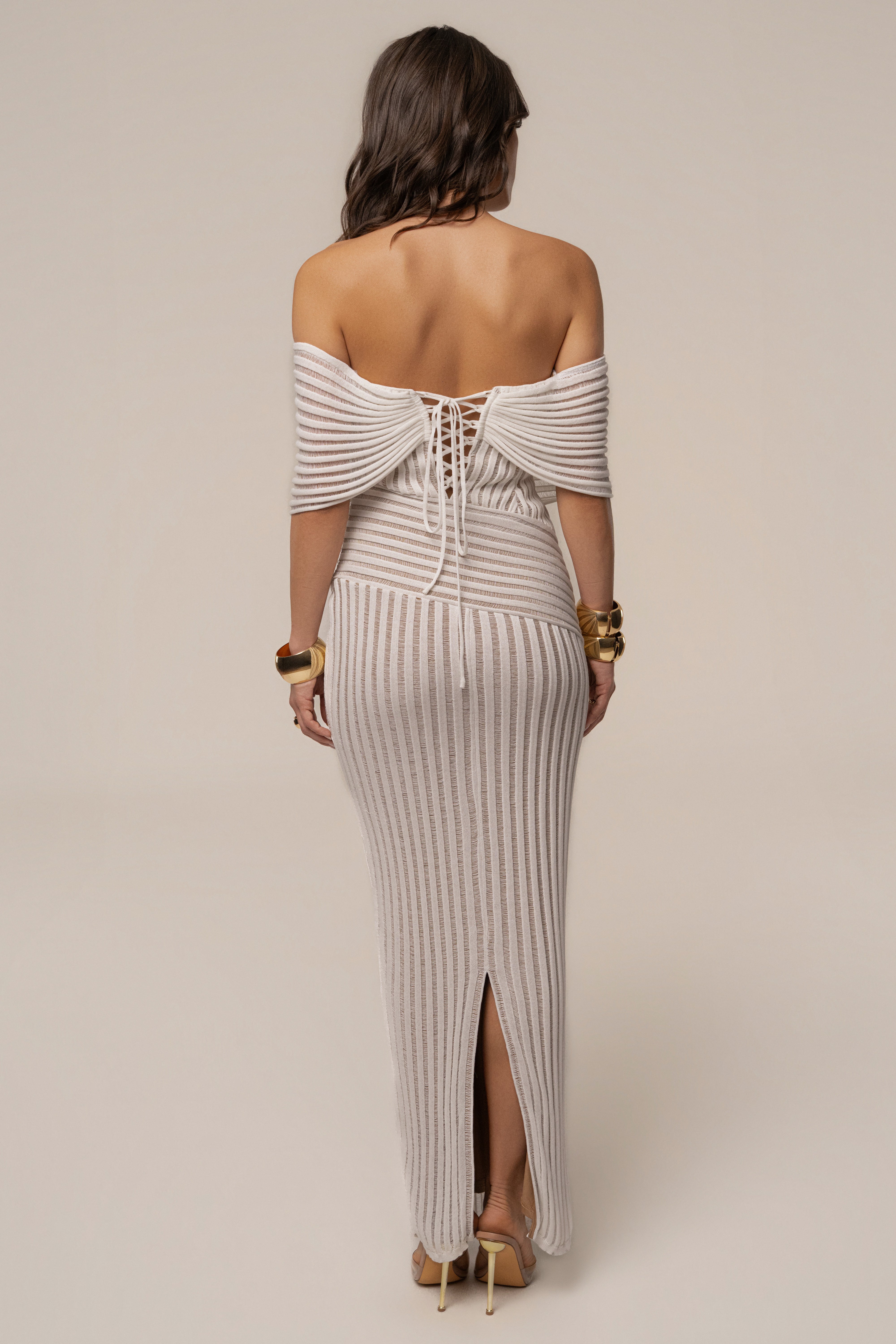 Ivory Midnight Siren Maxi Dress by JLUXLABEL, featuring flowing fabric and elegant design, shown on a model.