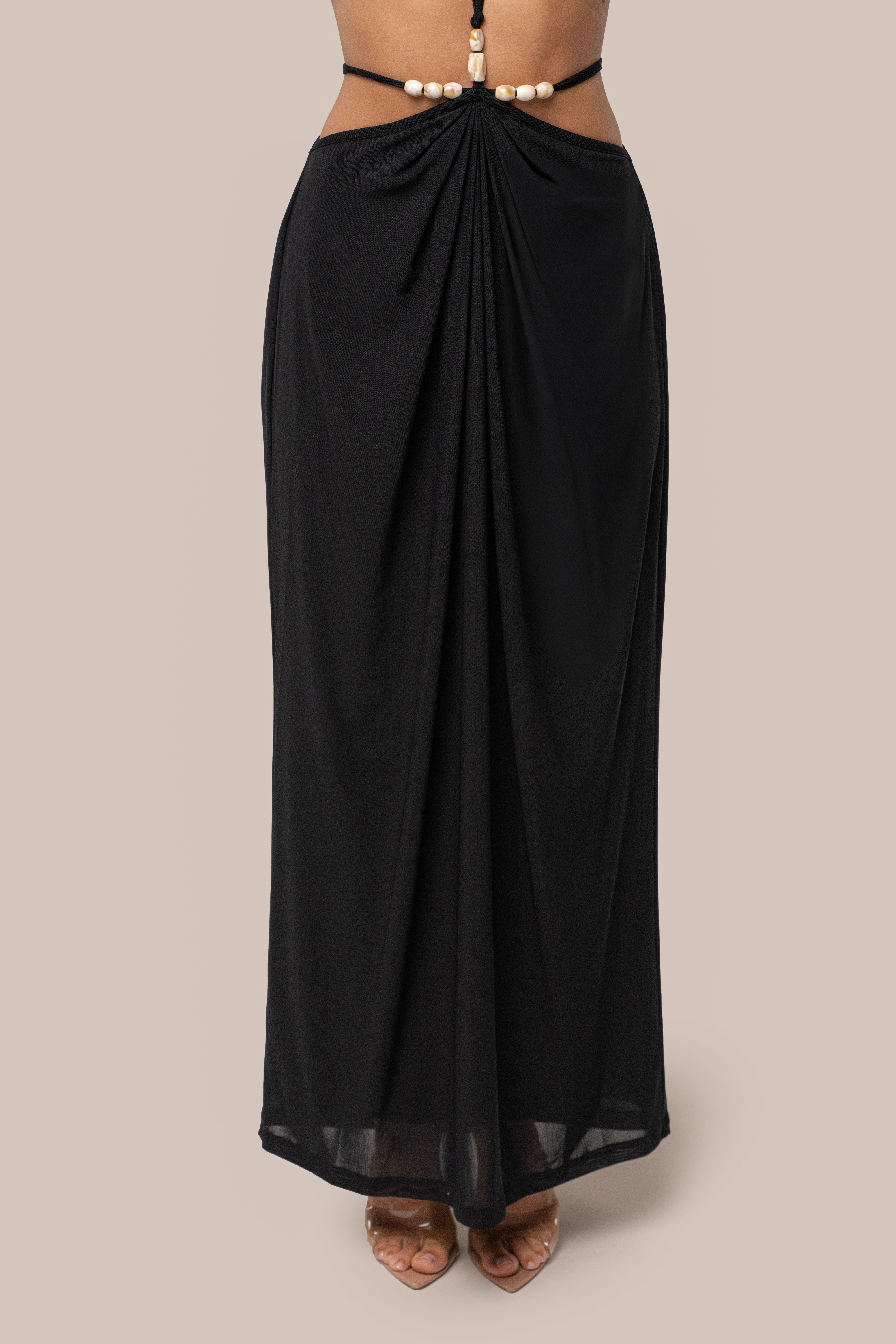 Black Hera Draped Maxi Skirt by JLUXLABEL, flowing black skirt with draped design, displayed on a neutral background.