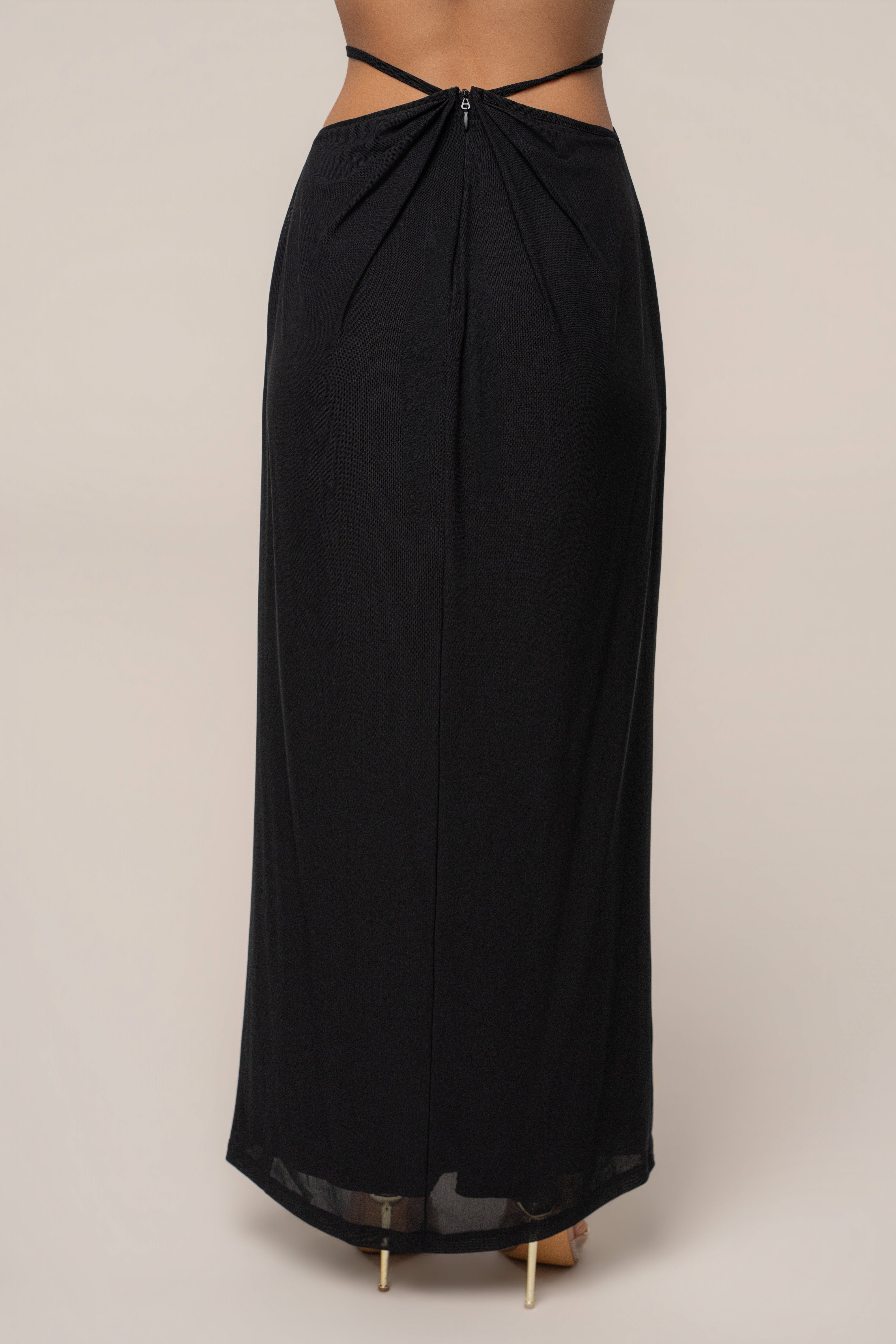 Black Hera Draped Maxi Skirt from JLUXLABEL featuring flowing fabric and a relaxed draped design, styled as a stylish bottom.
