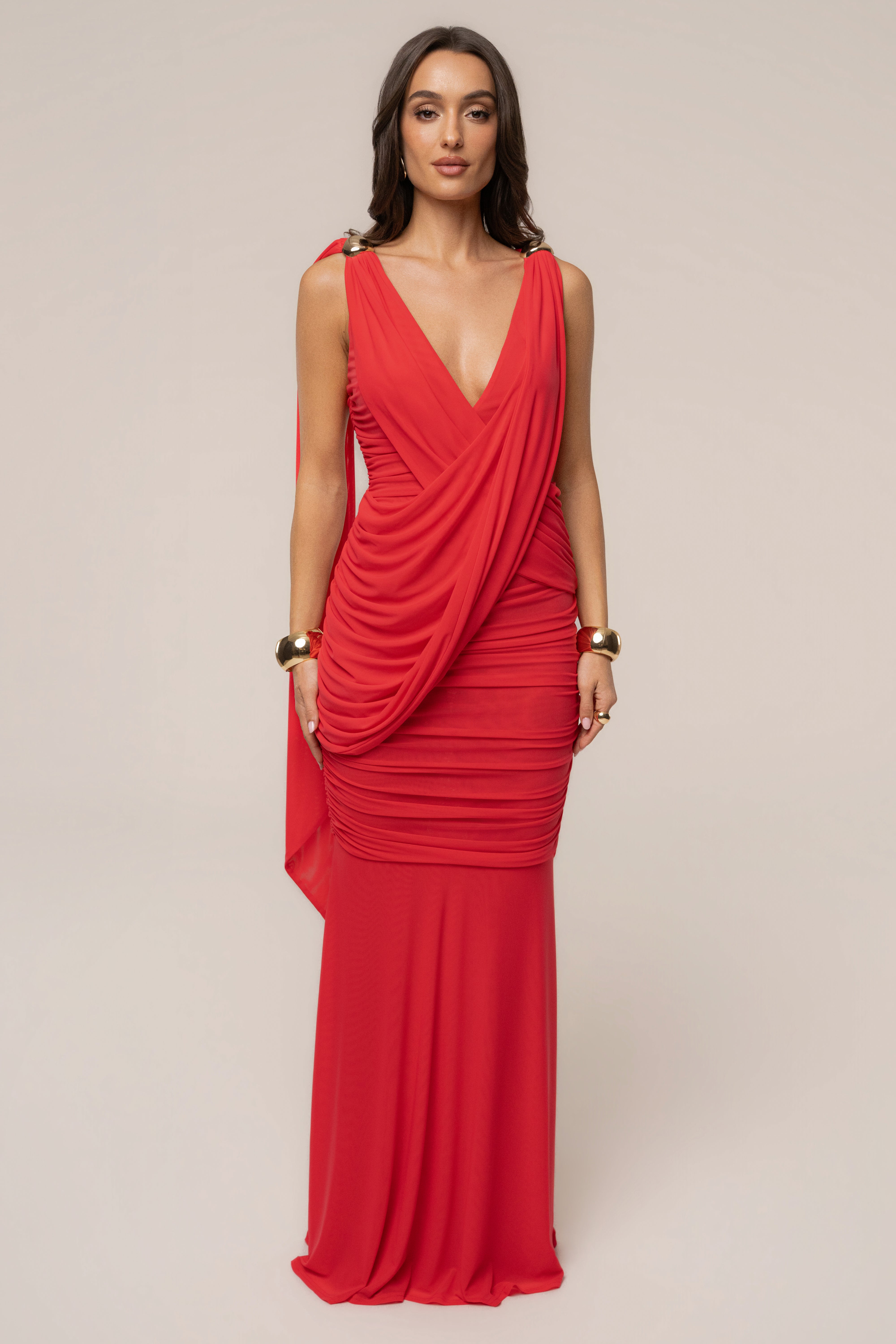 Hot coral Anastassia gold accent dress by JLUXLABEL, featuring elegant design and stylish details, displayed on a hanger.